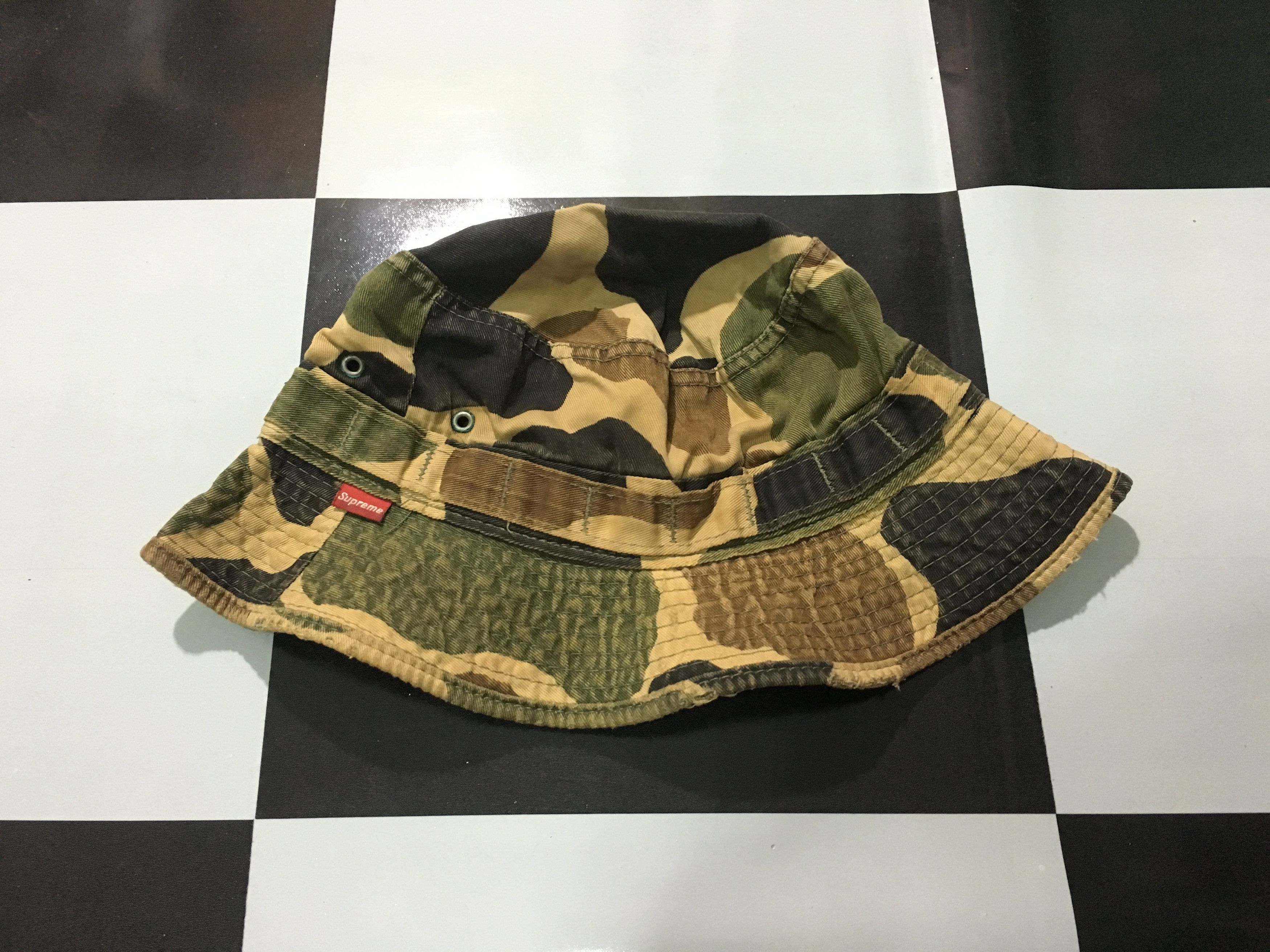 Supreme camo bucket hat sales