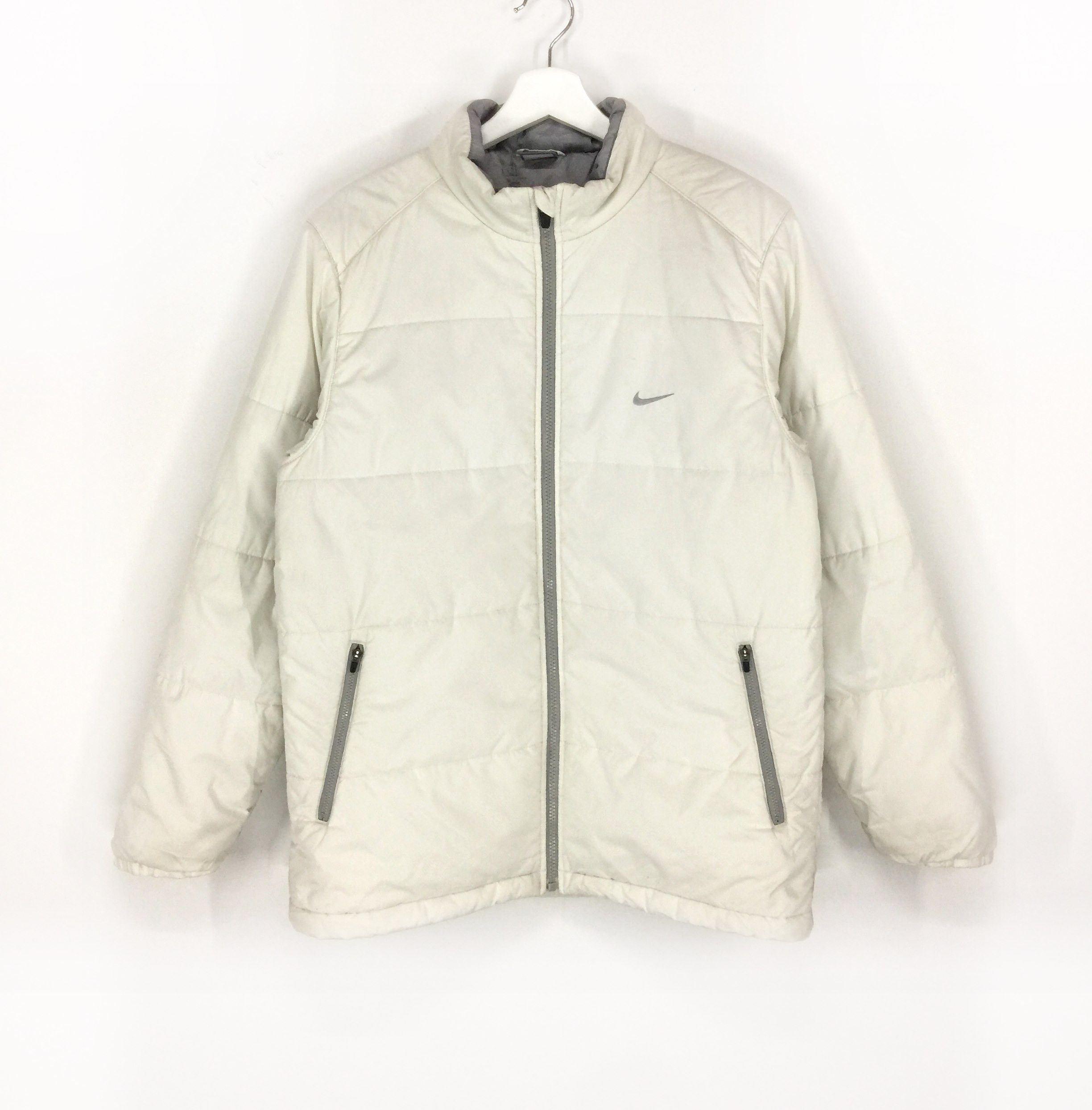 Nike white small logo padded jacket best sale