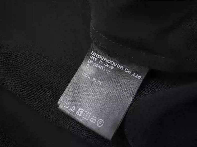 Undercover Black slogan shirt