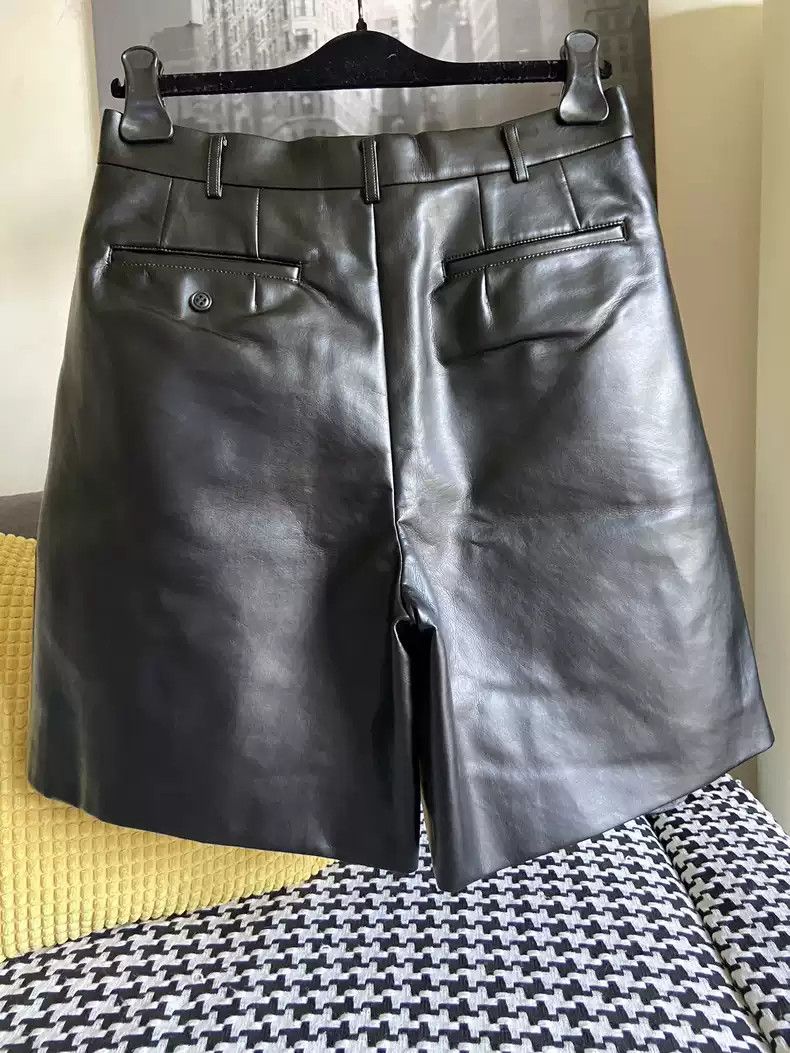 comme des garcons faux leather glossy shorts