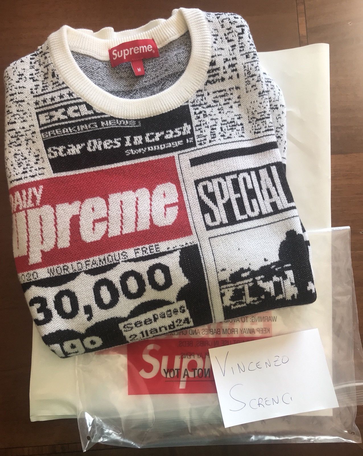 Supreme newsprint hot sale sweater white