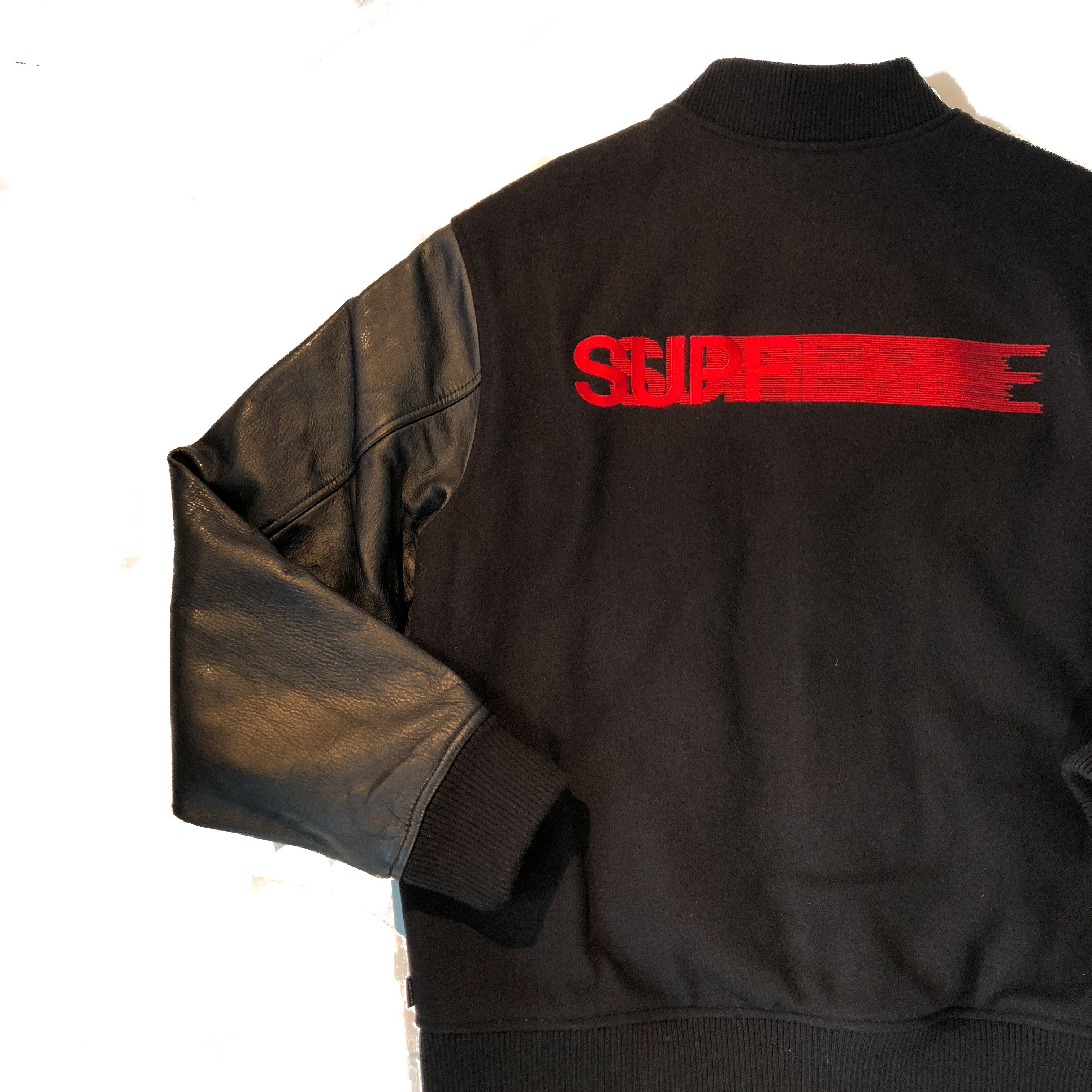 supreme motion logo varsity jacket-