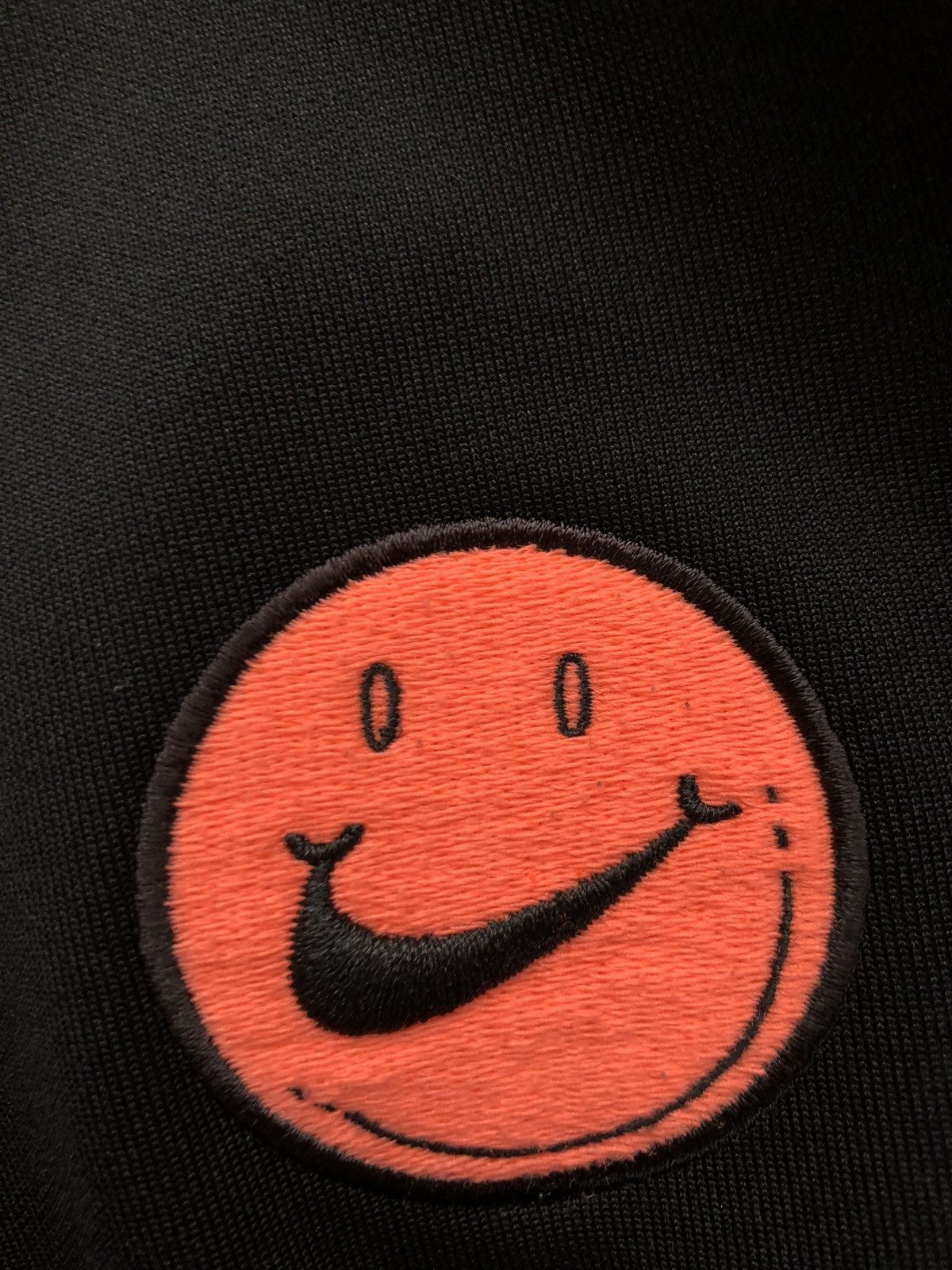 smiley face nike slides
