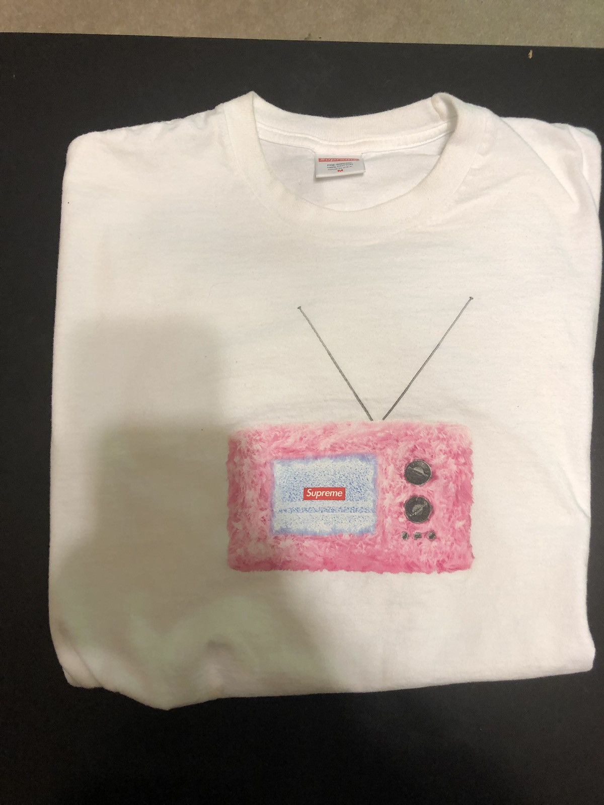 Supreme TV coupent tee size