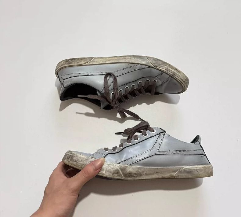 Saint Laurent Distressed Flat Casual Sneakers is available for