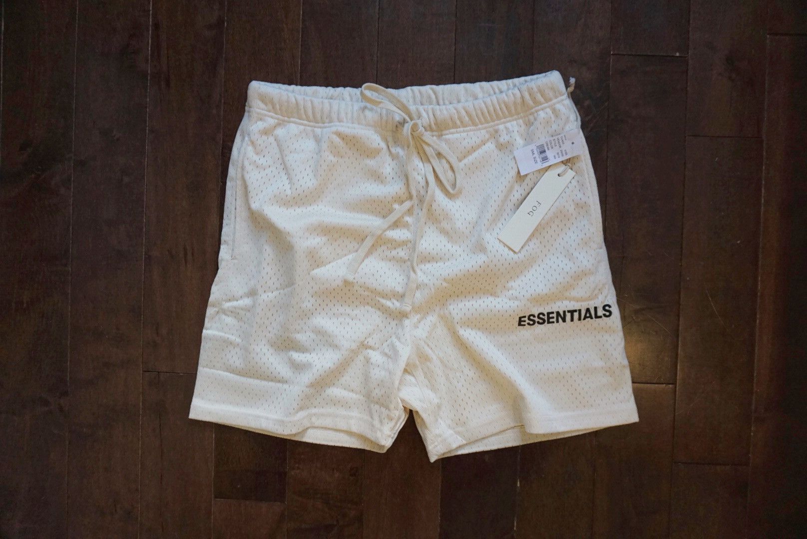 Fear of God Essentials Graphic Drawstring Mesh Shorts Cream | Grailed