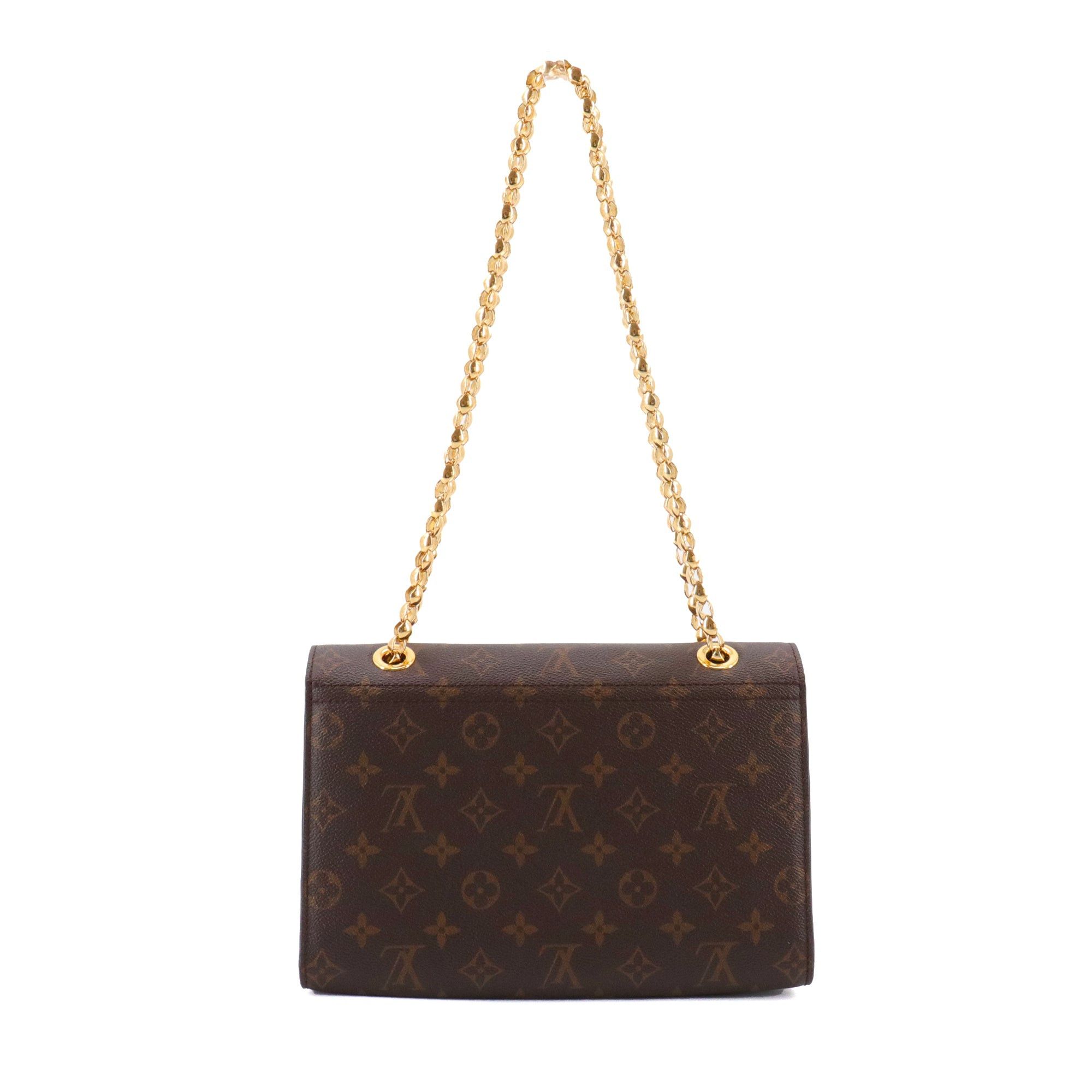 LOUIS VUITTON - Louis Vuitton Victoire shoulder bag in monogrammed canvas and black leather