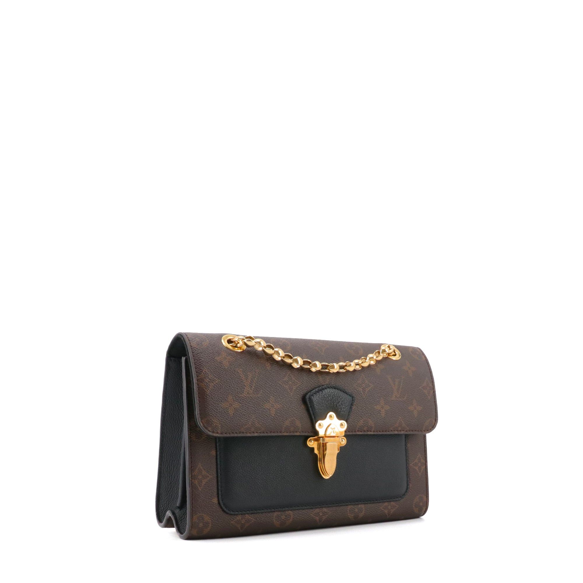 LOUIS VUITTON - Louis Vuitton Victoire shoulder bag in monogrammed canvas and black leather