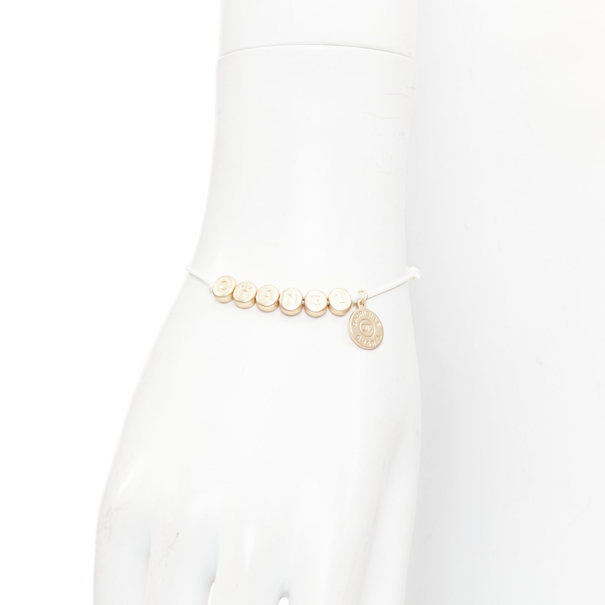 Chanel CHANEL white gold tone logo letter bead charm white thread lucky bracelet Size ONE SIZE - 2 Thumbnail