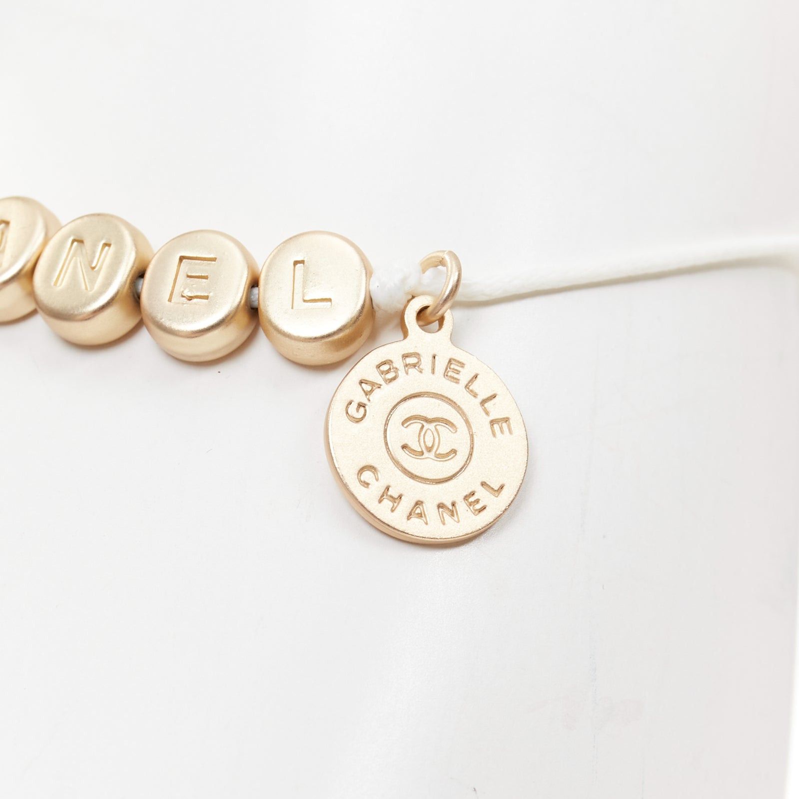 Chanel CHANEL white gold tone logo letter bead charm white thread lucky bracelet Size ONE SIZE - 3 Thumbnail