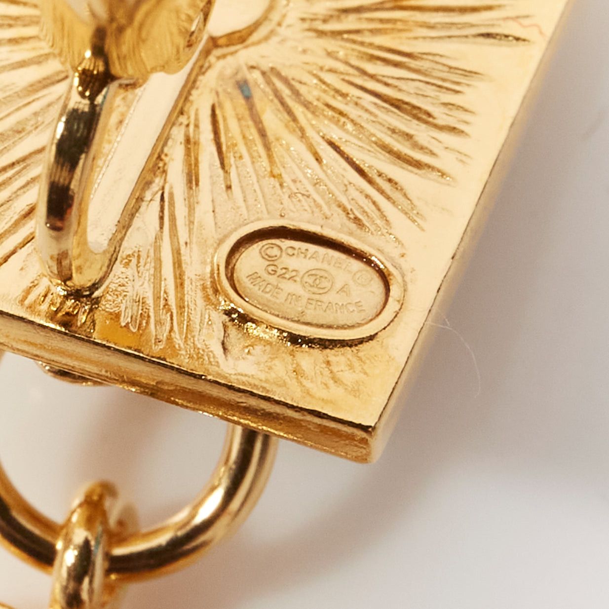 CHANEL G22A gold CC charm Lion Head square stud clip on earrings pair