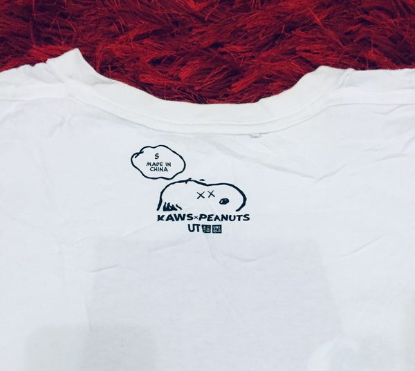 Uniqlo Uniqlo x Kaws X Peanuts Snoopy T-shirt | Grailed