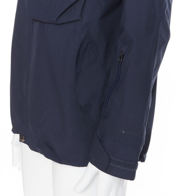 The North Face THE NORTH FACE GORE TEX blue asymmetric zip patch pocket hood windbreaker M / L Size US M / EU 48-50 / 2 - 9 Thumbnail