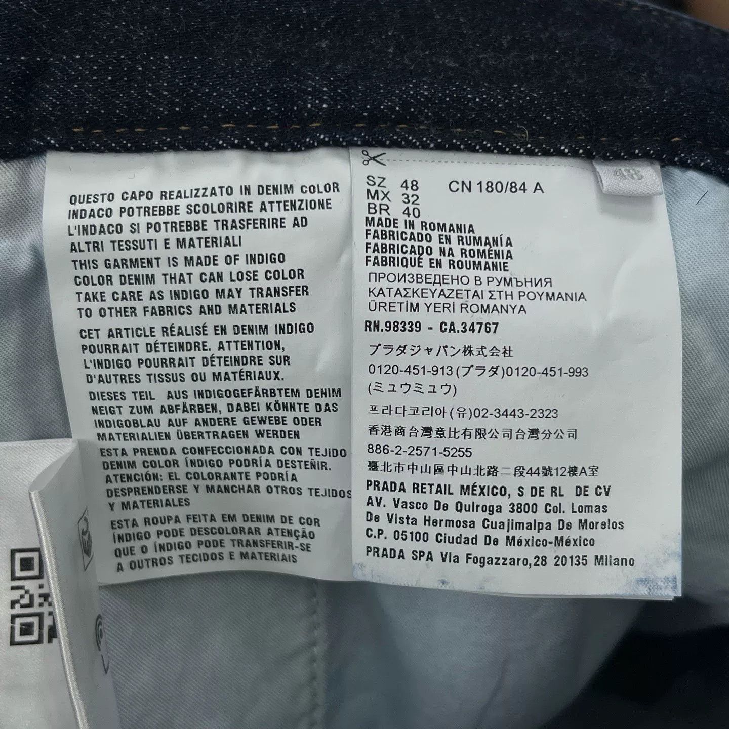 Prada Solid Triangle Logo Denim Shorts