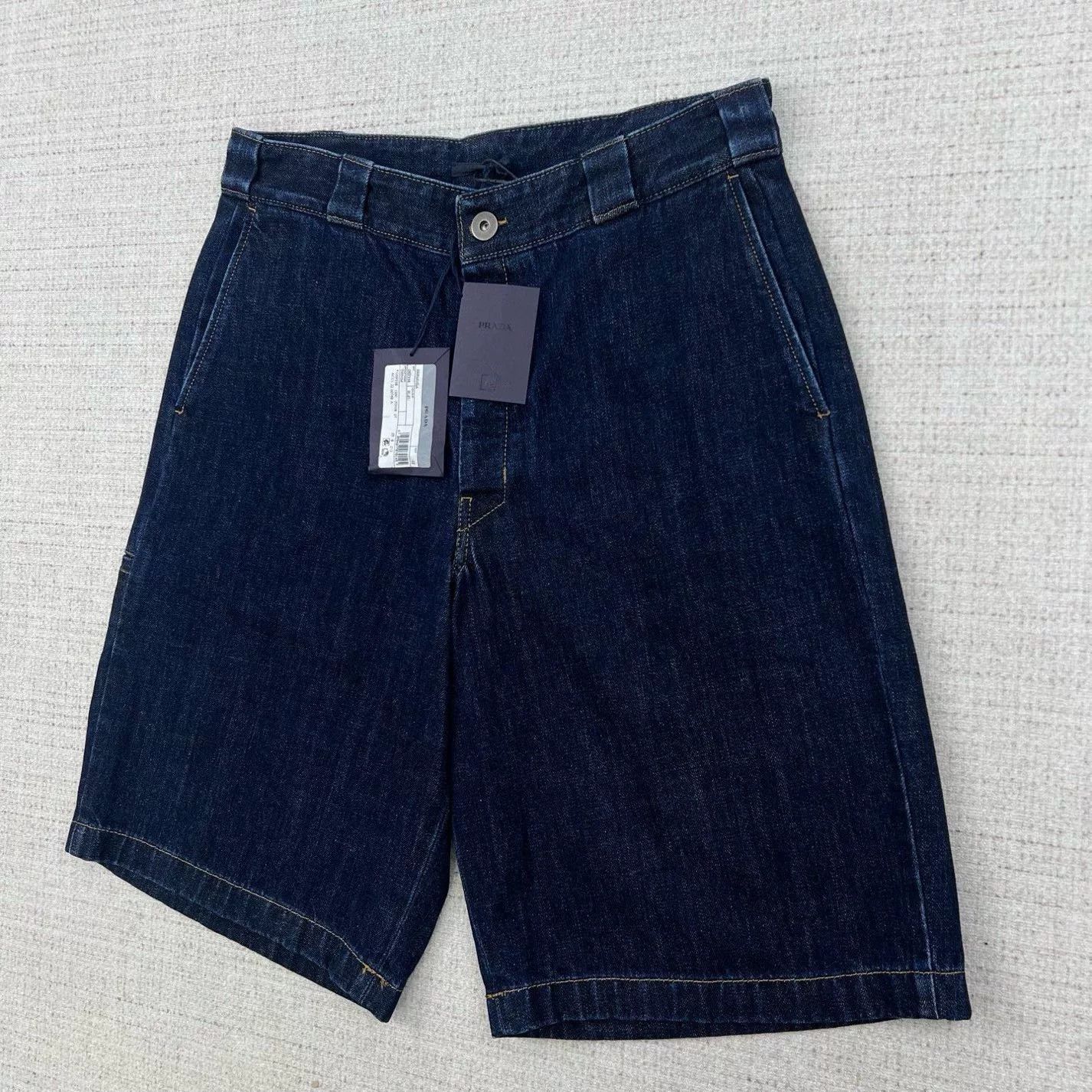 Prada Solid Triangle Logo Denim Shorts