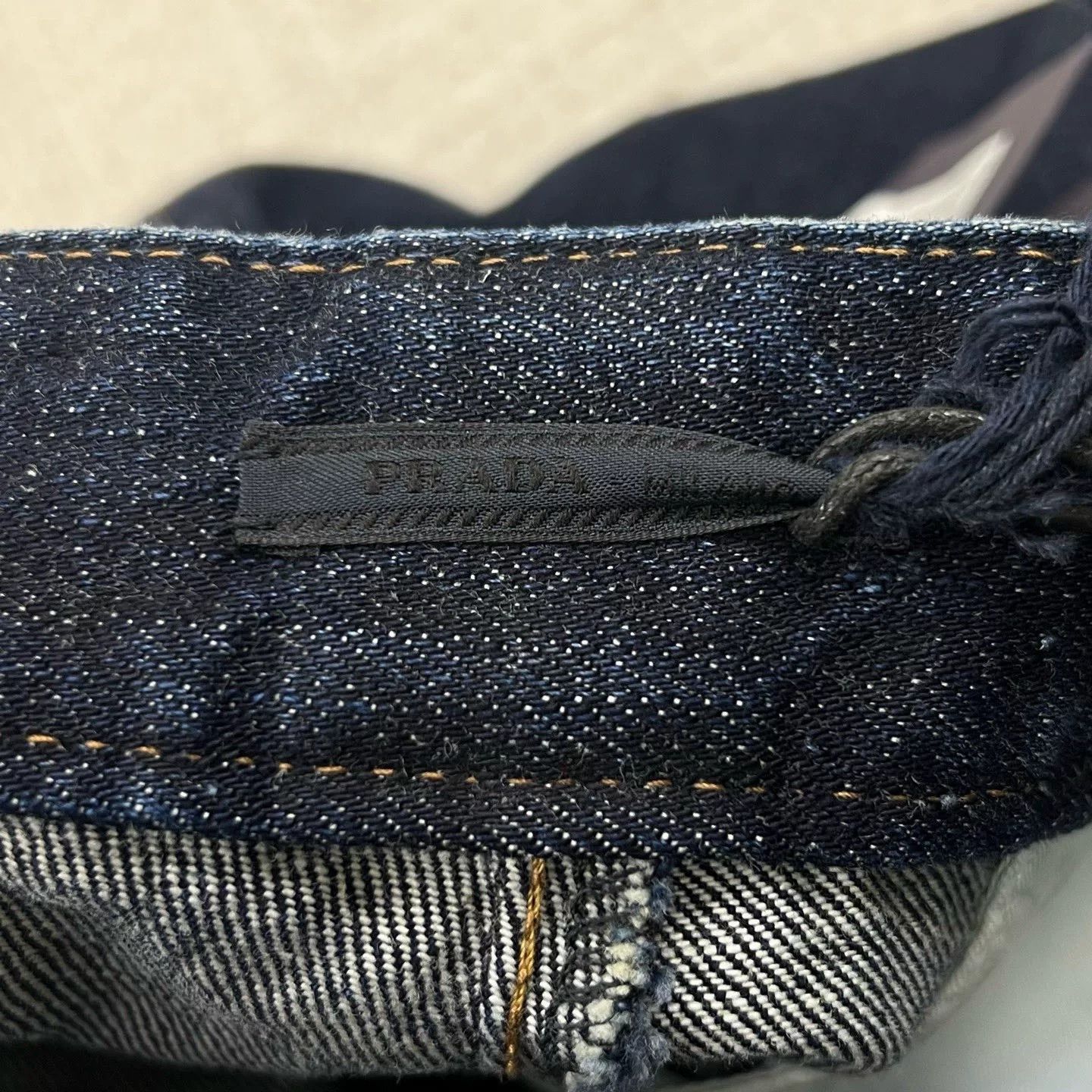 Prada Solid Triangle Logo Denim Shorts