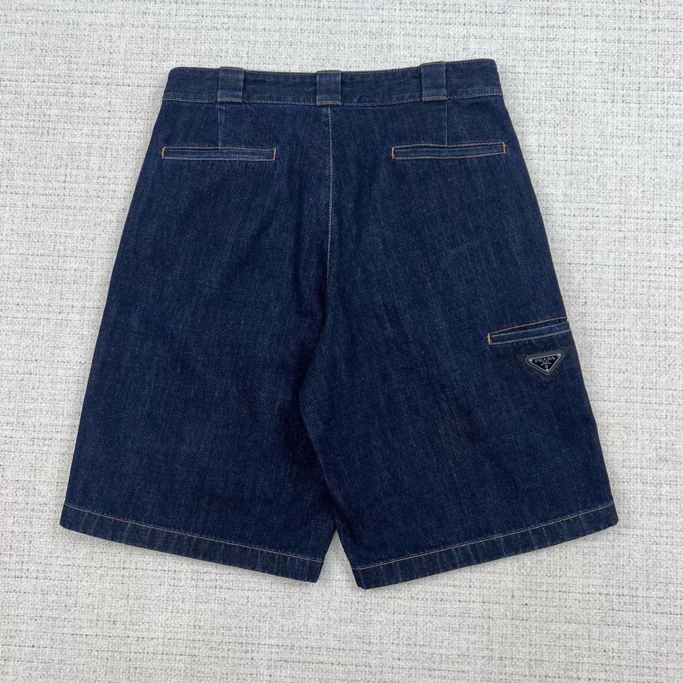 Prada Solid Triangle Logo Denim Shorts