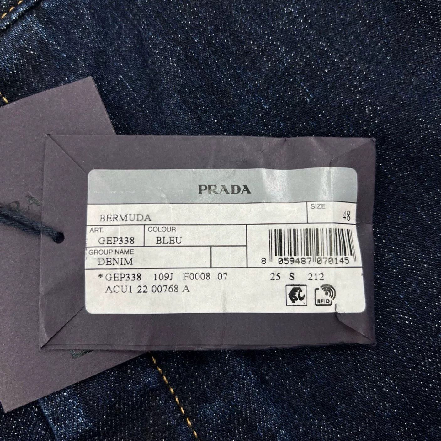 Prada Solid Triangle Logo Denim Shorts