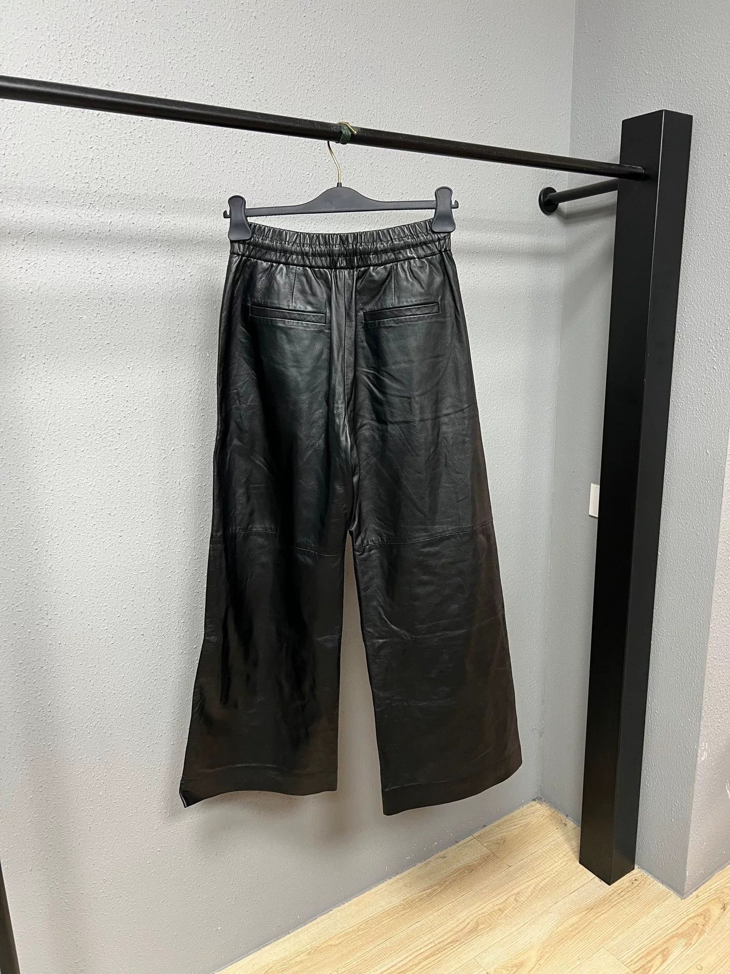 black wide-leg leather pants