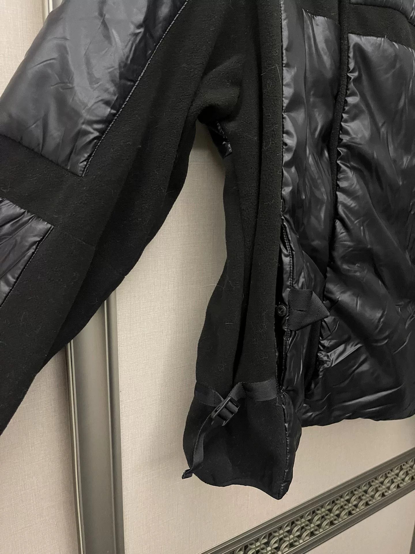 black puffy jacket with hidden pockets