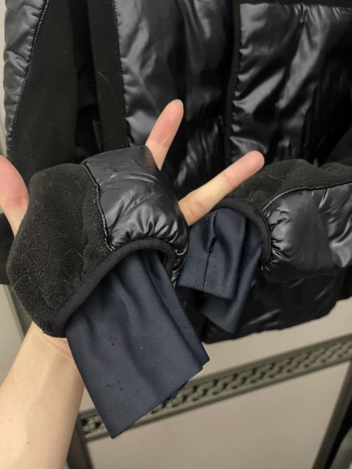 black puffy jacket with hidden pockets