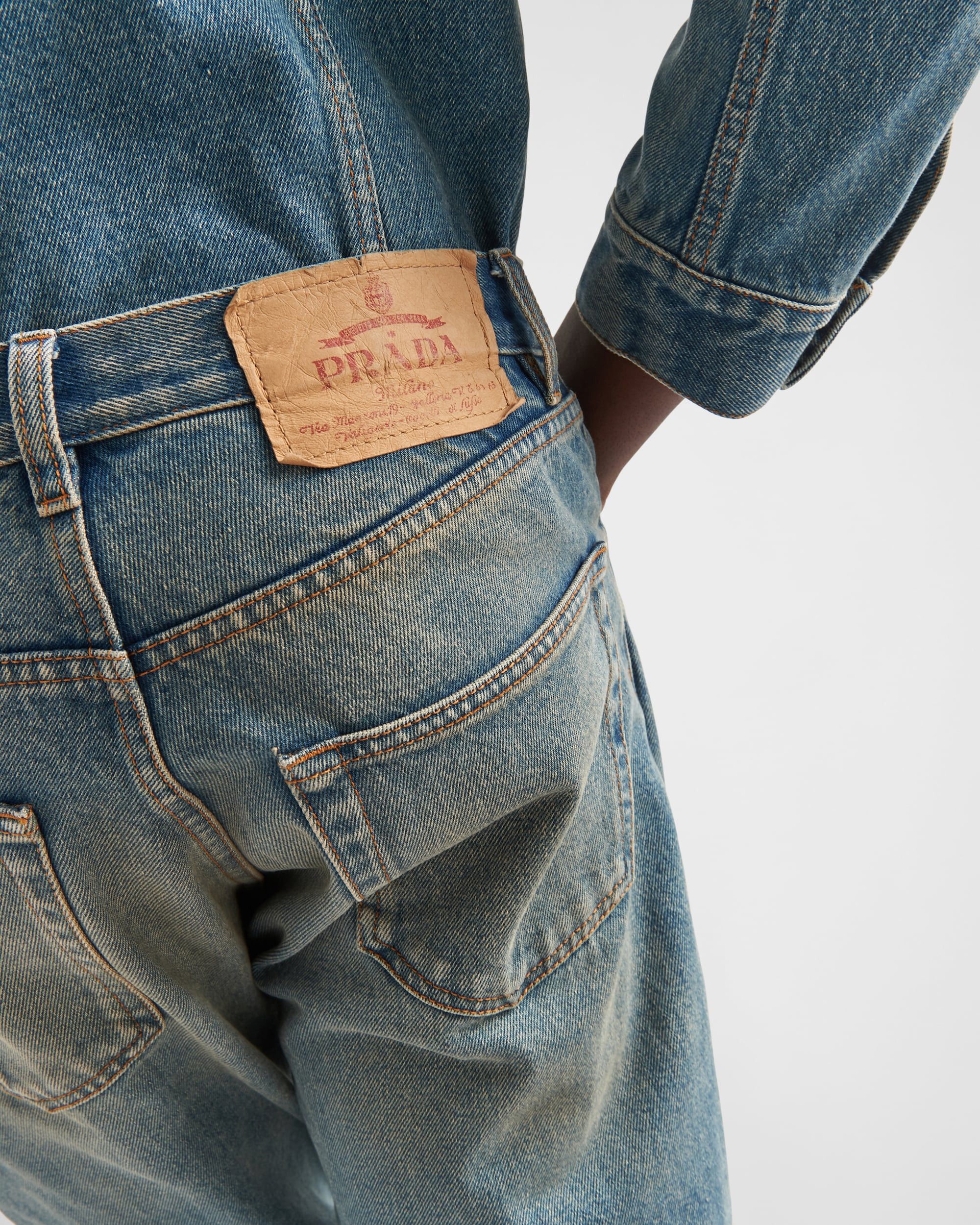 Five-pocket denim jeans with Prada patch