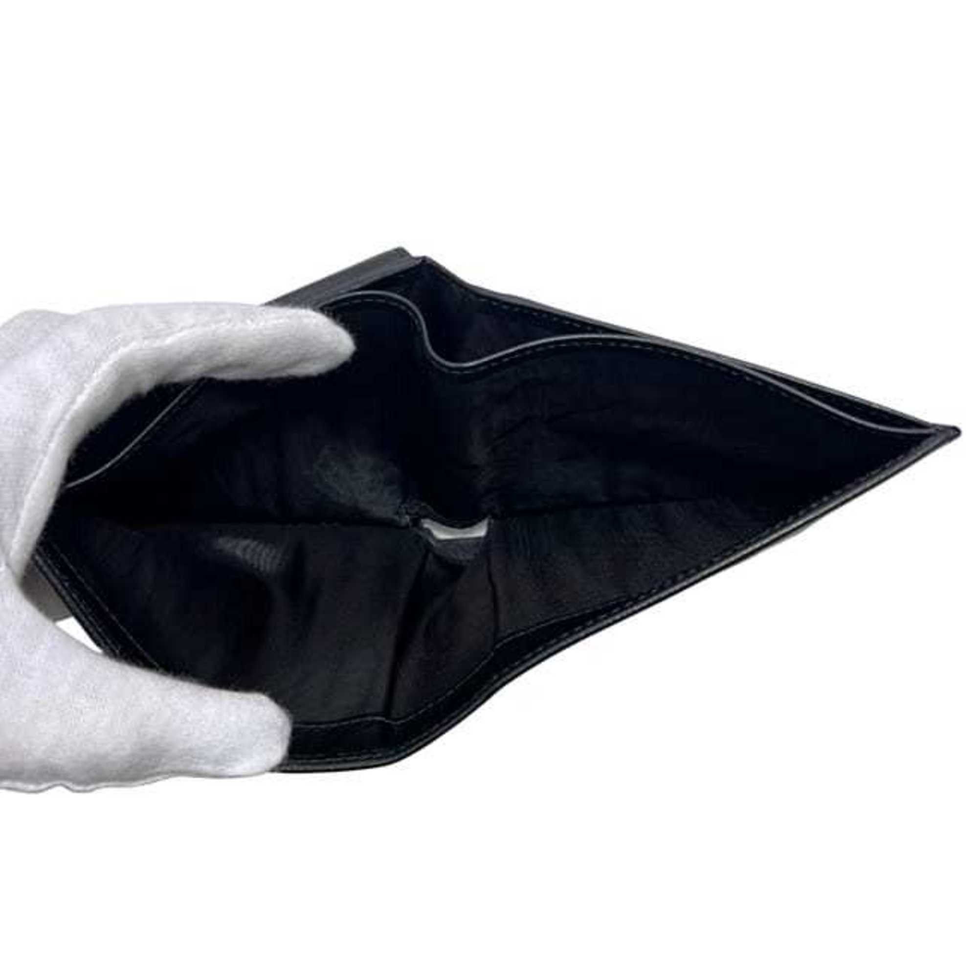 Salvatore Ferragamo Salvatore Ferragamo bifold wallet ec-25055 in black with Gancini KD 66 9296 leather. This is made of coated leather and suitable for both men women. Size ONE SIZE - 5 Thumbnail