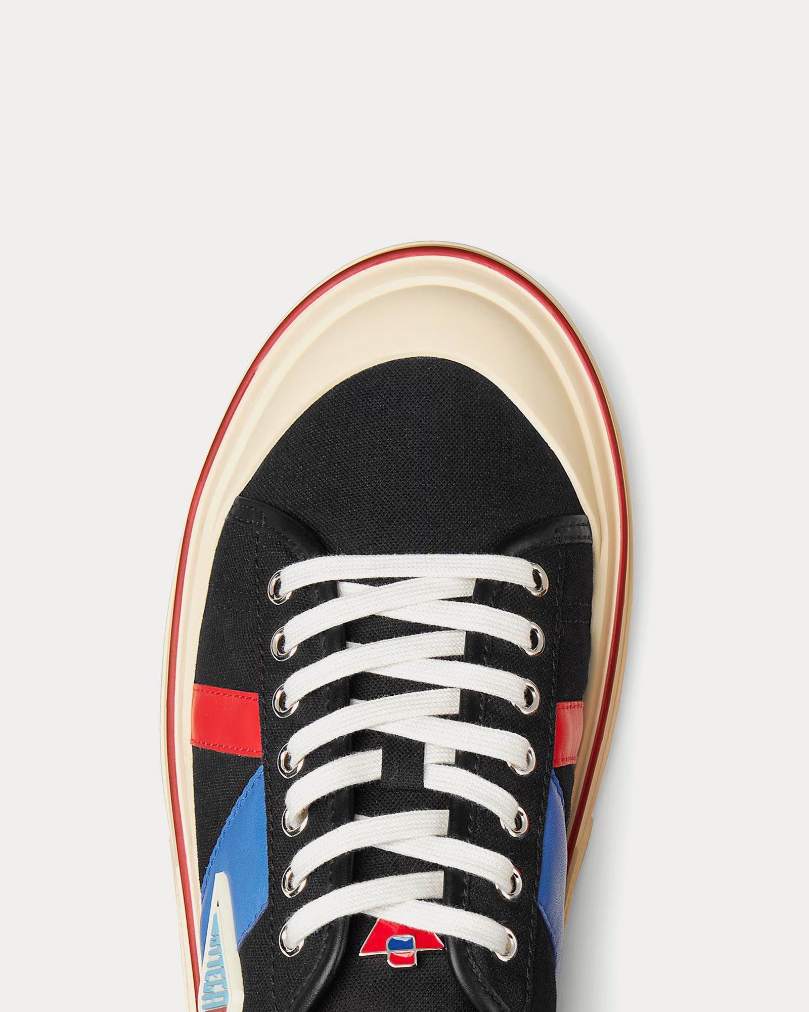 Eliot leather-trimmed canvas low top sneakers in black
