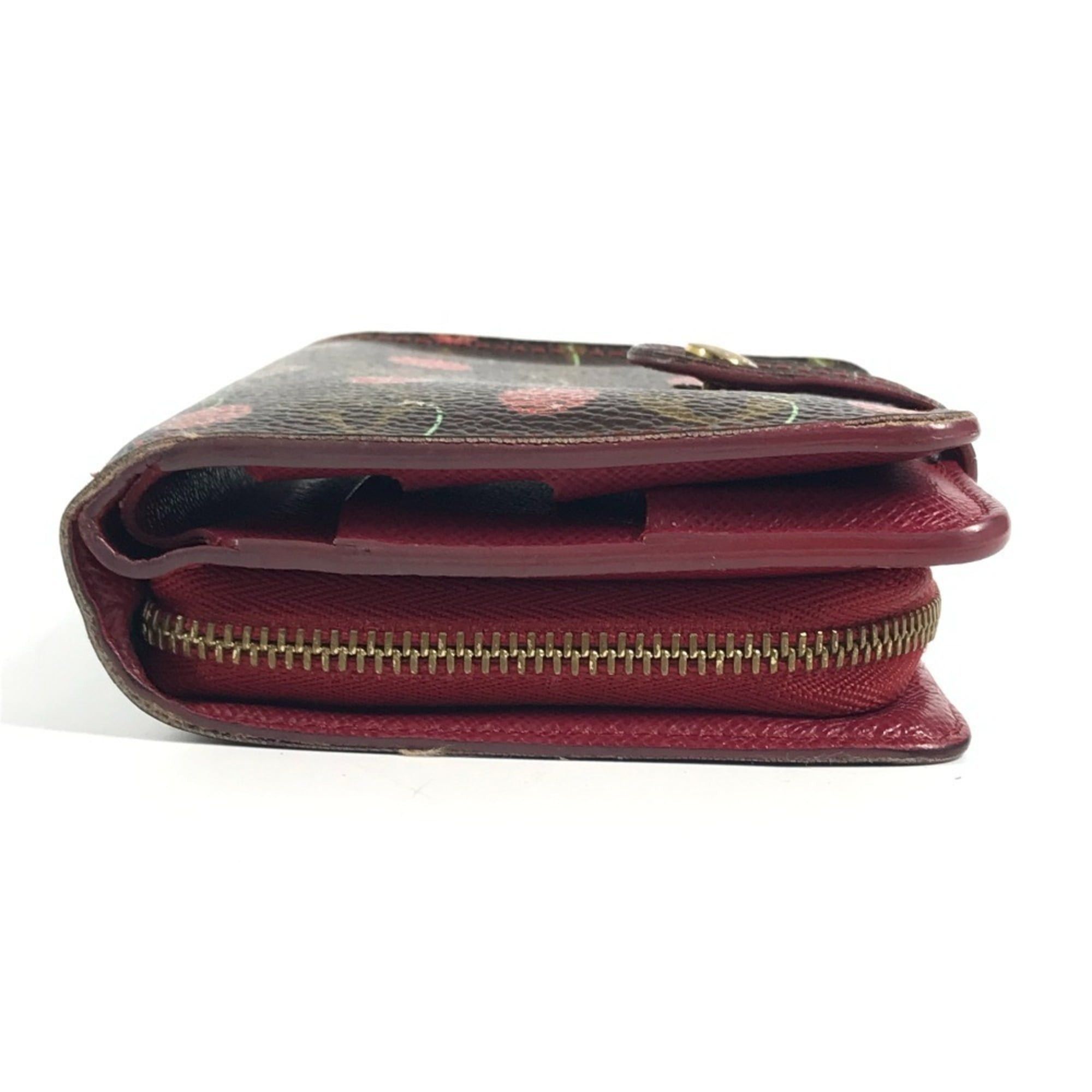 LOUIS VUITTON M95005 Monogram Cherry Compact Zip Wallet, designed by Takashi Murakami, featuring a cherry design. This compact, bi-fold wallet is crafted from canvas and available in brown for both men women.