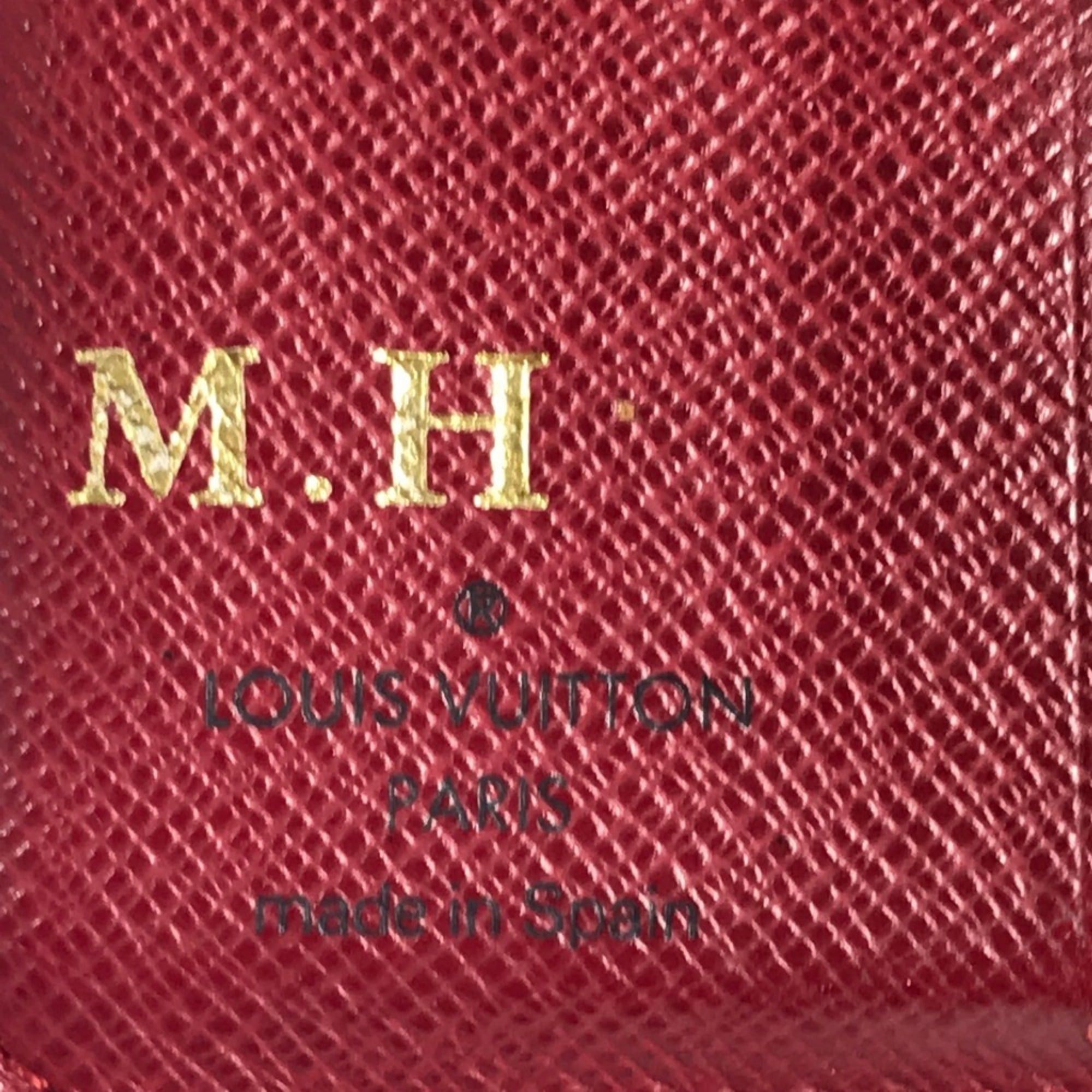 LOUIS VUITTON M95005 Monogram Cherry Compact Zip Wallet, designed by Takashi Murakami, featuring a cherry design. This compact, bi-fold wallet is crafted from canvas and available in brown for both men women.