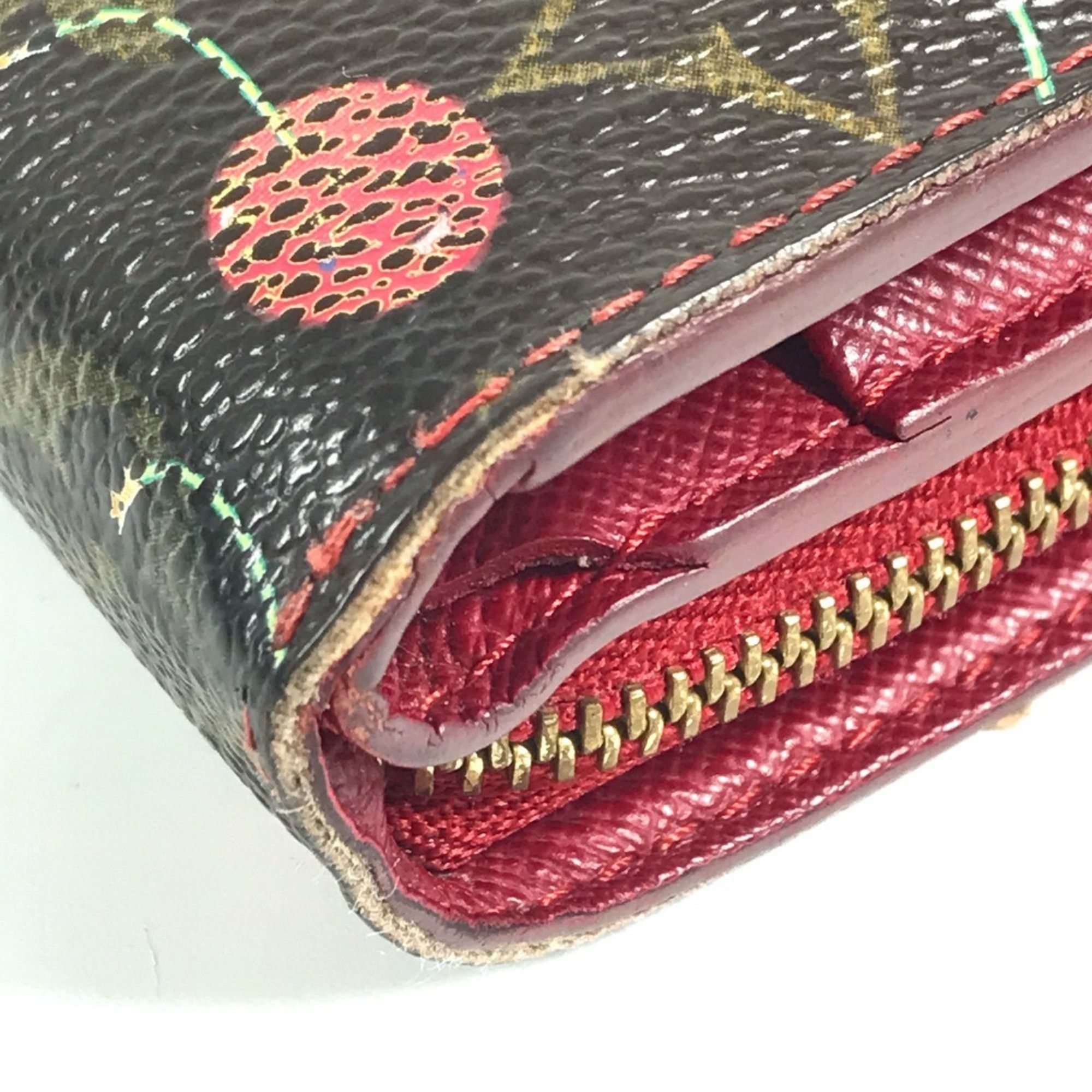 LOUIS VUITTON M95005 Monogram Cherry Compact Zip Wallet, designed by Takashi Murakami, featuring a cherry design. This compact, bi-fold wallet is crafted from canvas and available in brown for both men women.