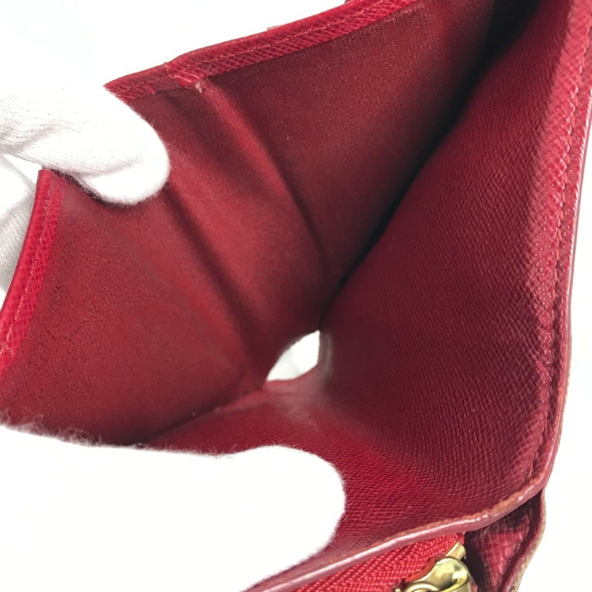 LOUIS VUITTON M95005 Monogram Cherry Compact Zip Wallet, designed by Takashi Murakami, featuring a cherry design. This compact, bi-fold wallet is crafted from canvas and available in brown for both men women.