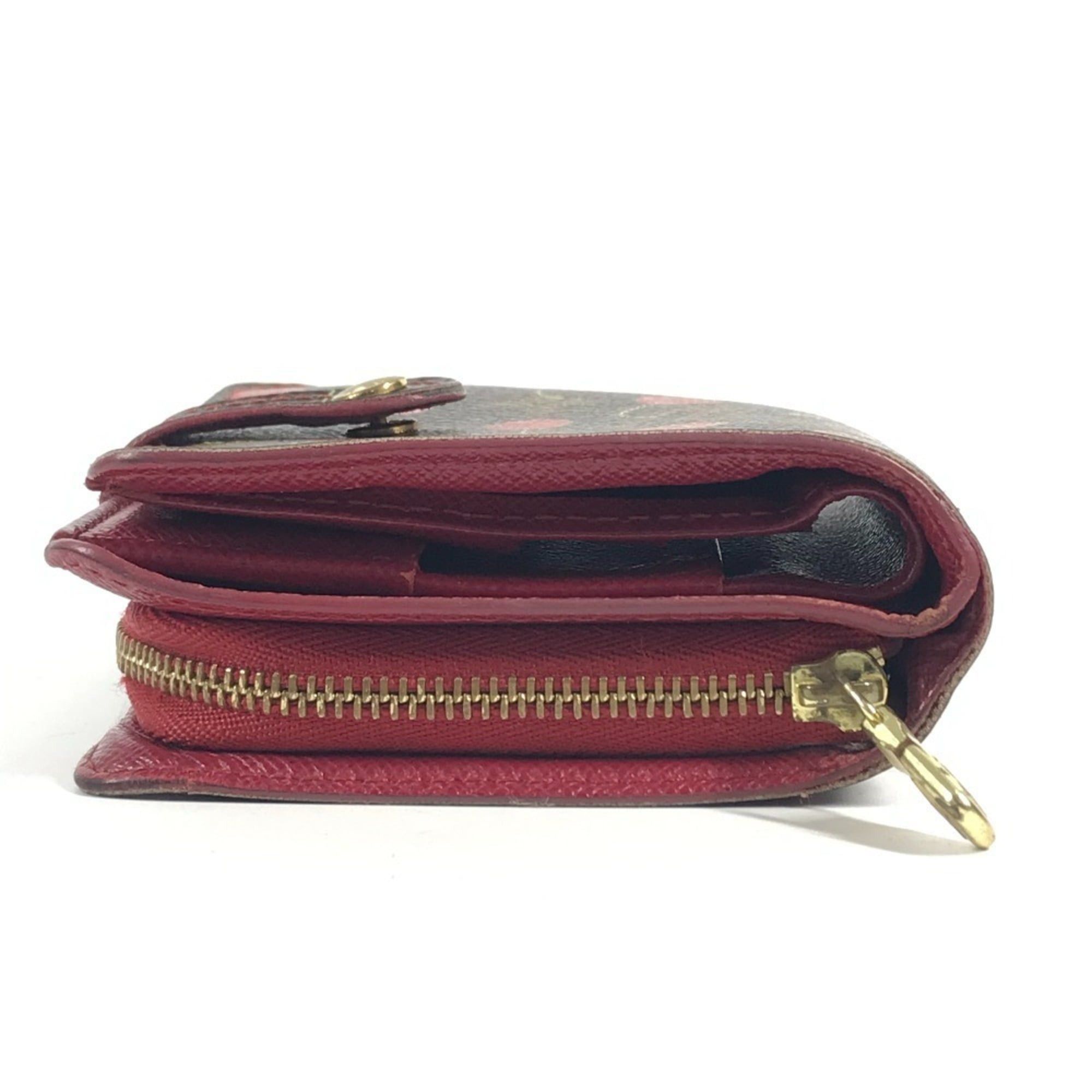 LOUIS VUITTON M95005 Monogram Cherry Compact Zip Wallet, designed by Takashi Murakami, featuring a cherry design. This compact, bi-fold wallet is crafted from canvas and available in brown for both men women.