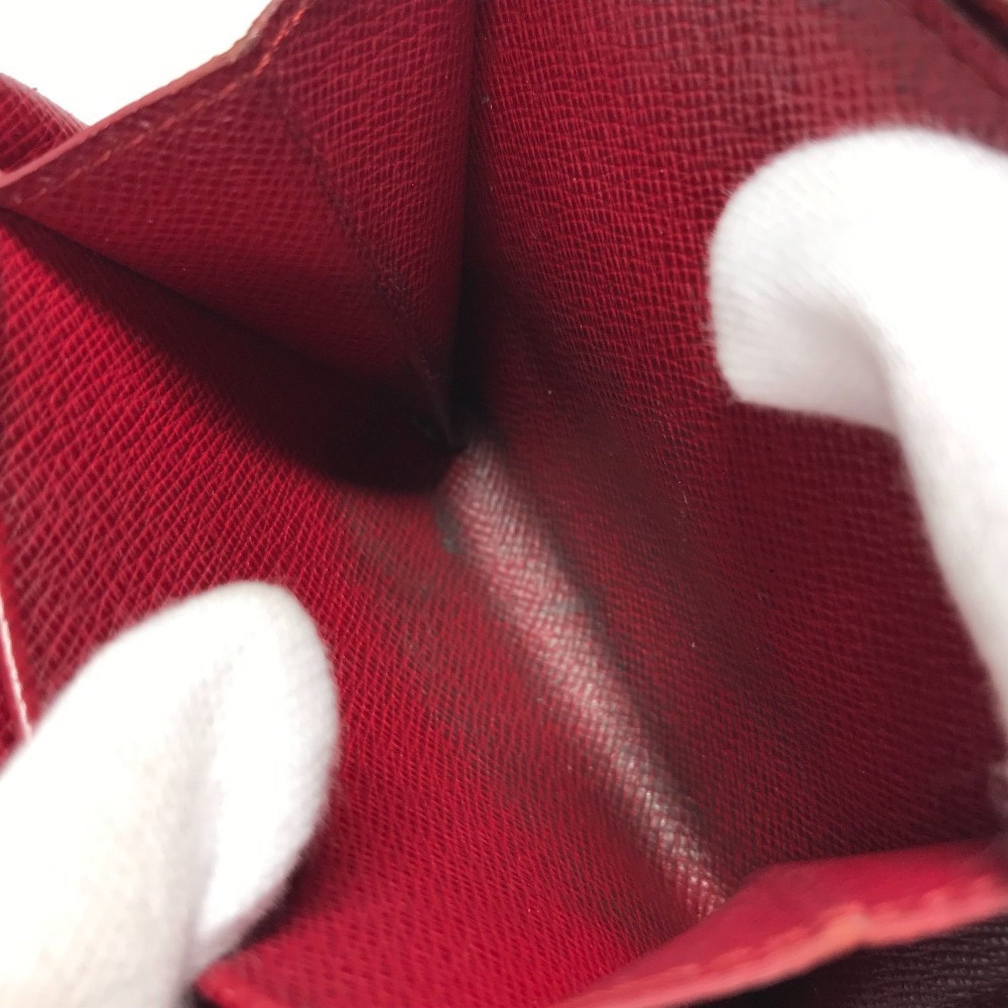 LOUIS VUITTON M95005 Monogram Cherry Compact Zip Wallet, designed by Takashi Murakami, featuring a cherry design. This compact, bi-fold wallet is crafted from canvas and available in brown for both men women.