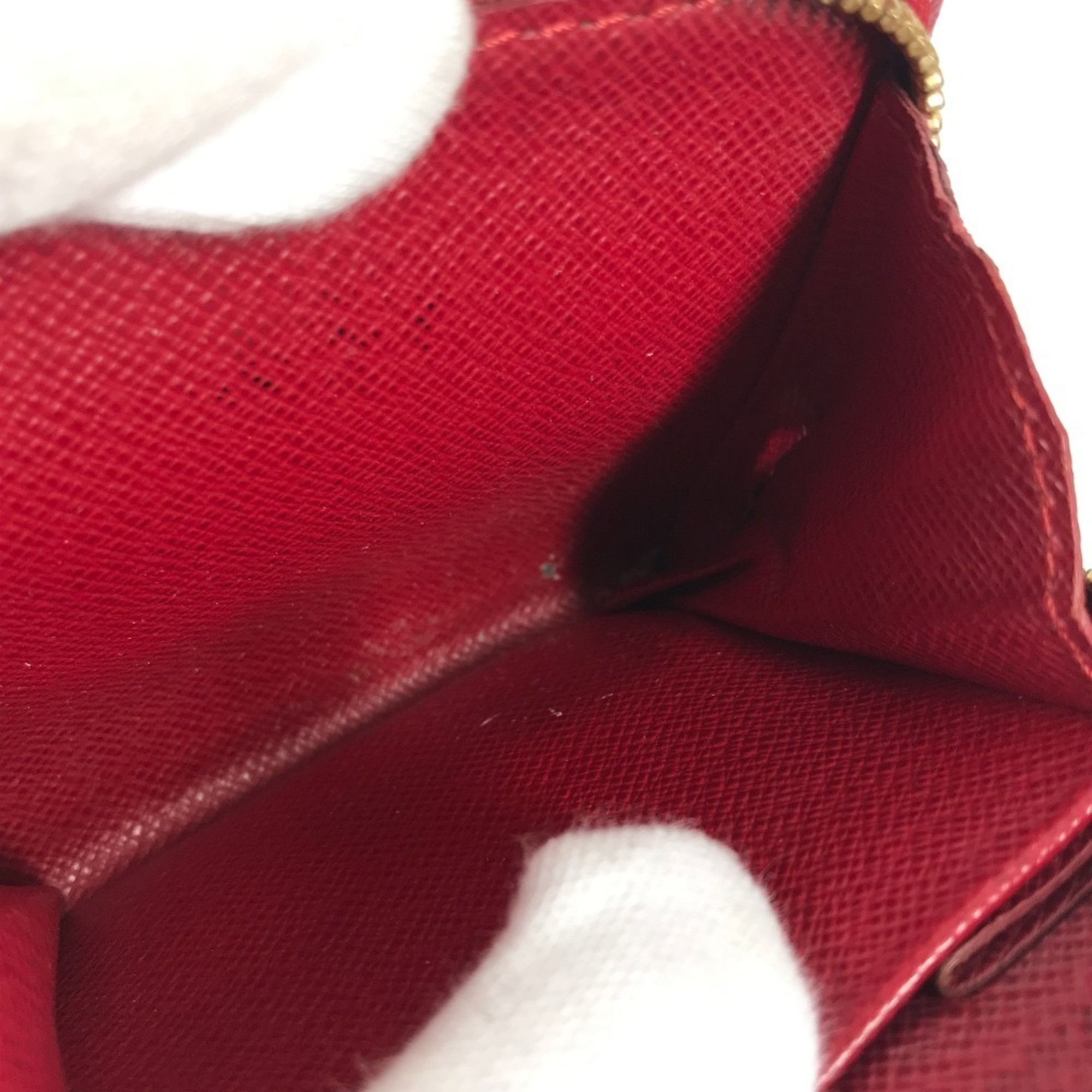 LOUIS VUITTON M95005 Monogram Cherry Compact Zip Wallet, designed by Takashi Murakami, featuring a cherry design. This compact, bi-fold wallet is crafted from canvas and available in brown for both men women.