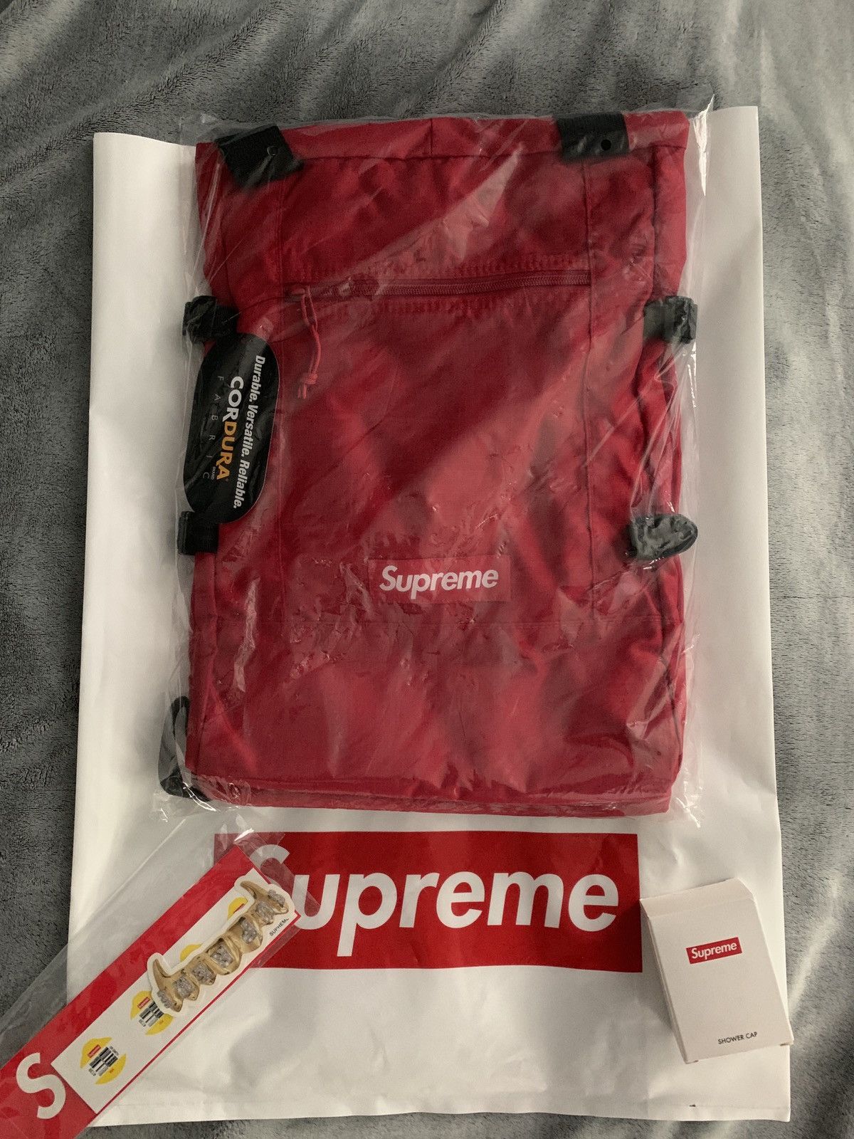 Supreme tote clearance backpack red