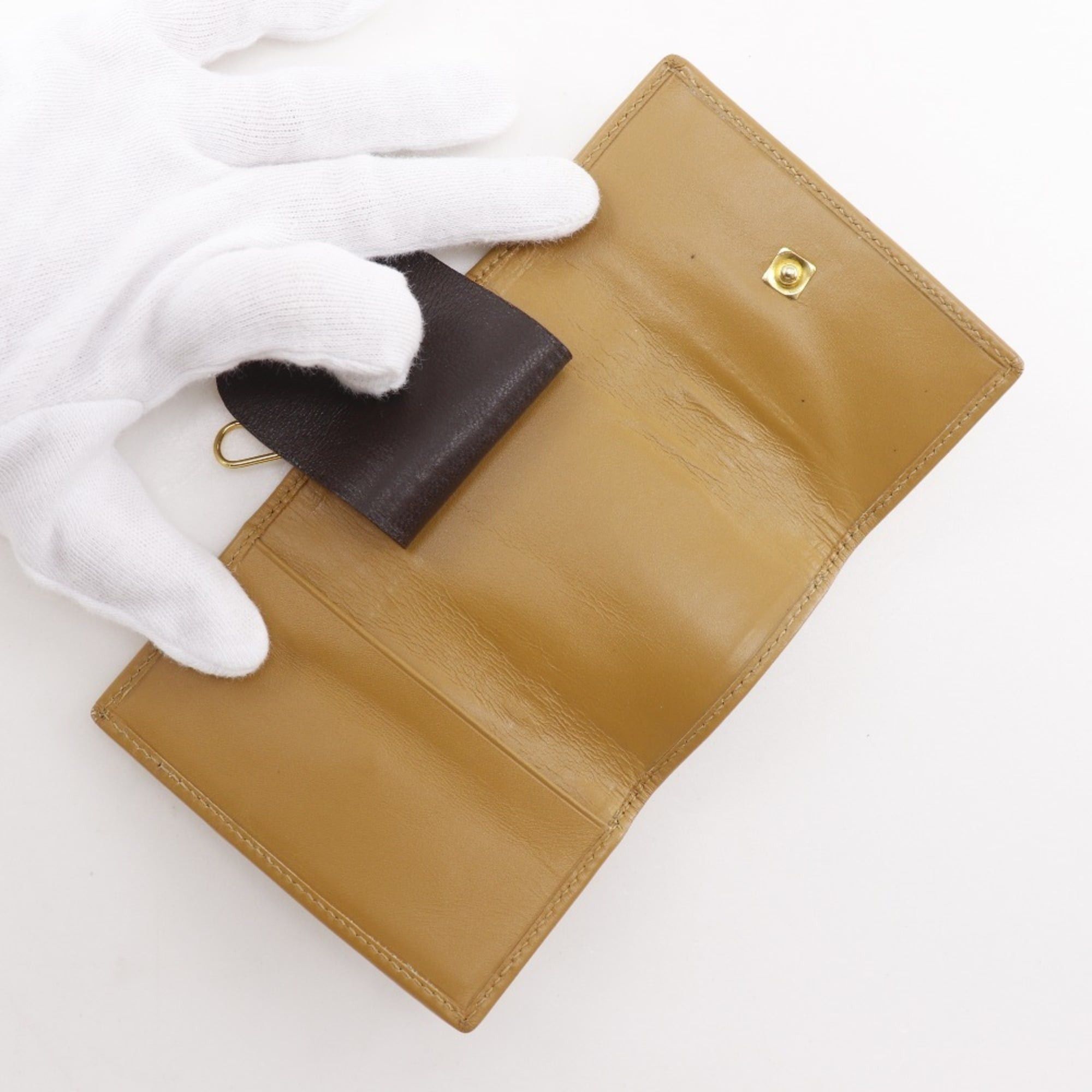 Gucci Gucci key case, model number 033.0416.0881, GG canvas, ochre color, snap button closure, unisex. Size ONE SIZE - 7 Thumbnail