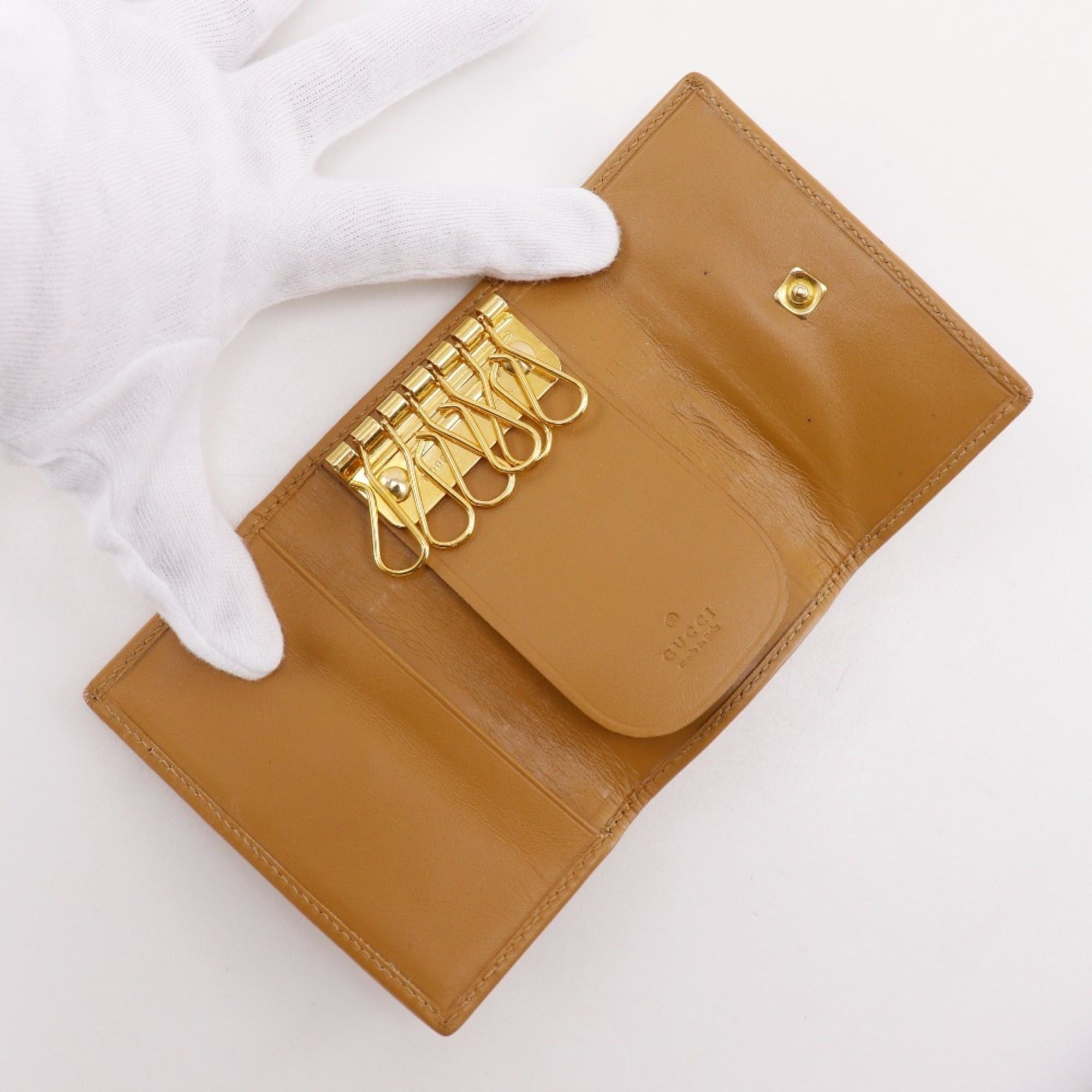 Gucci Gucci key case, model number 033.0416.0881, GG canvas, ochre color, snap button closure, unisex. Size ONE SIZE - 5 Thumbnail