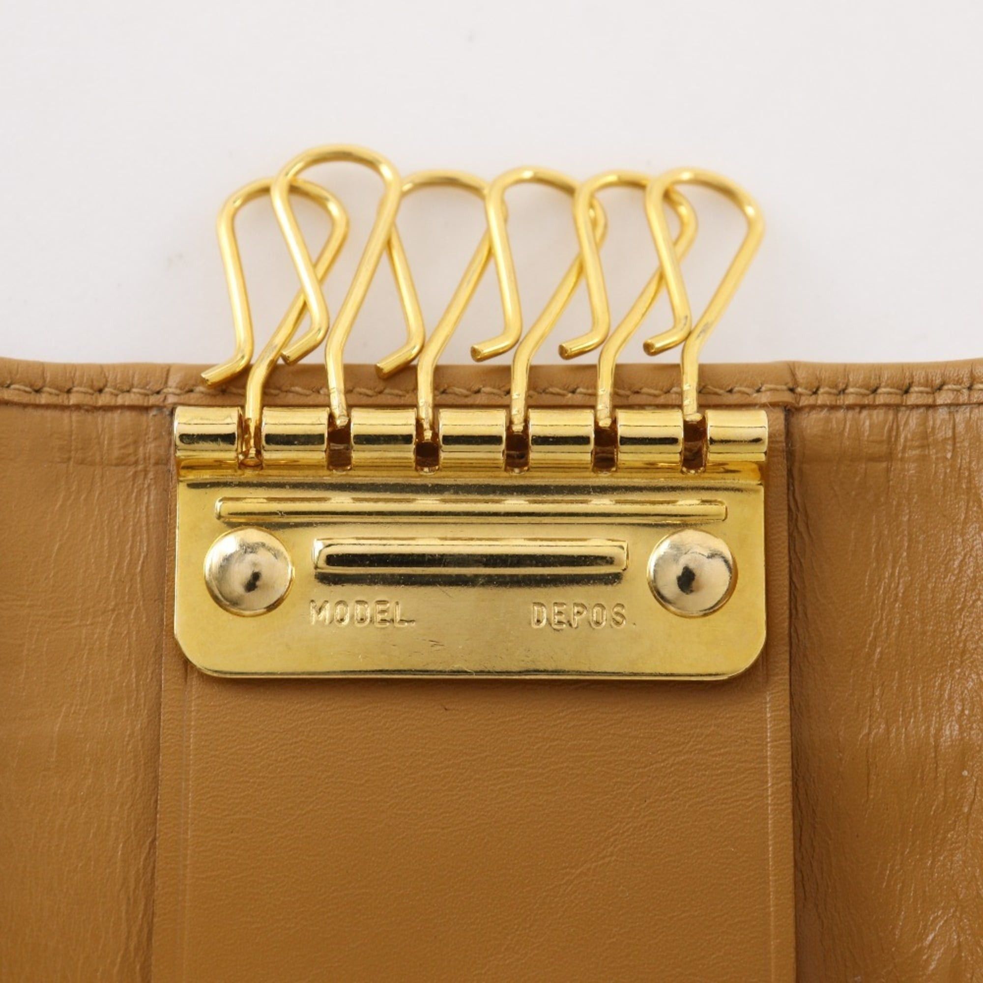 Gucci Gucci key case, model number 033.0416.0881, GG canvas, ochre color, snap button closure, unisex. Size ONE SIZE - 6 Thumbnail