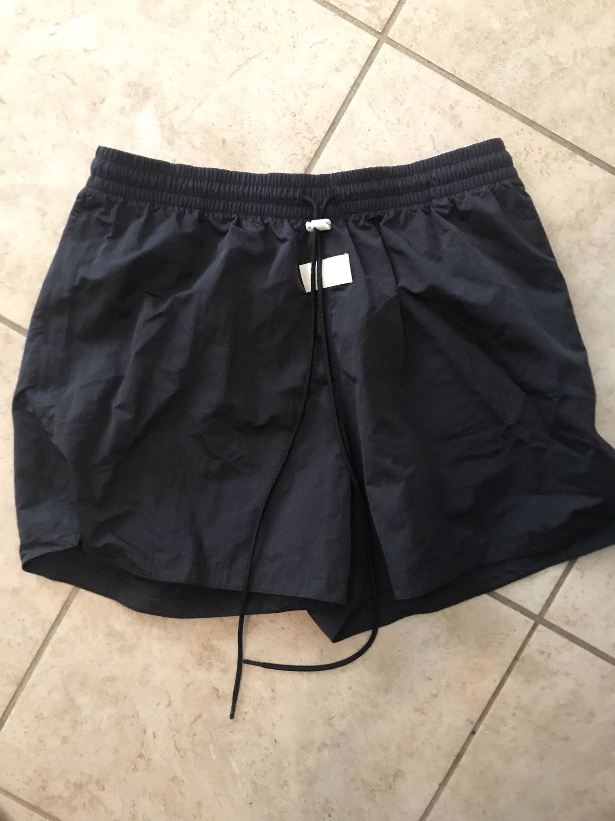 Fear of god x nike shorts black/light cream sales
