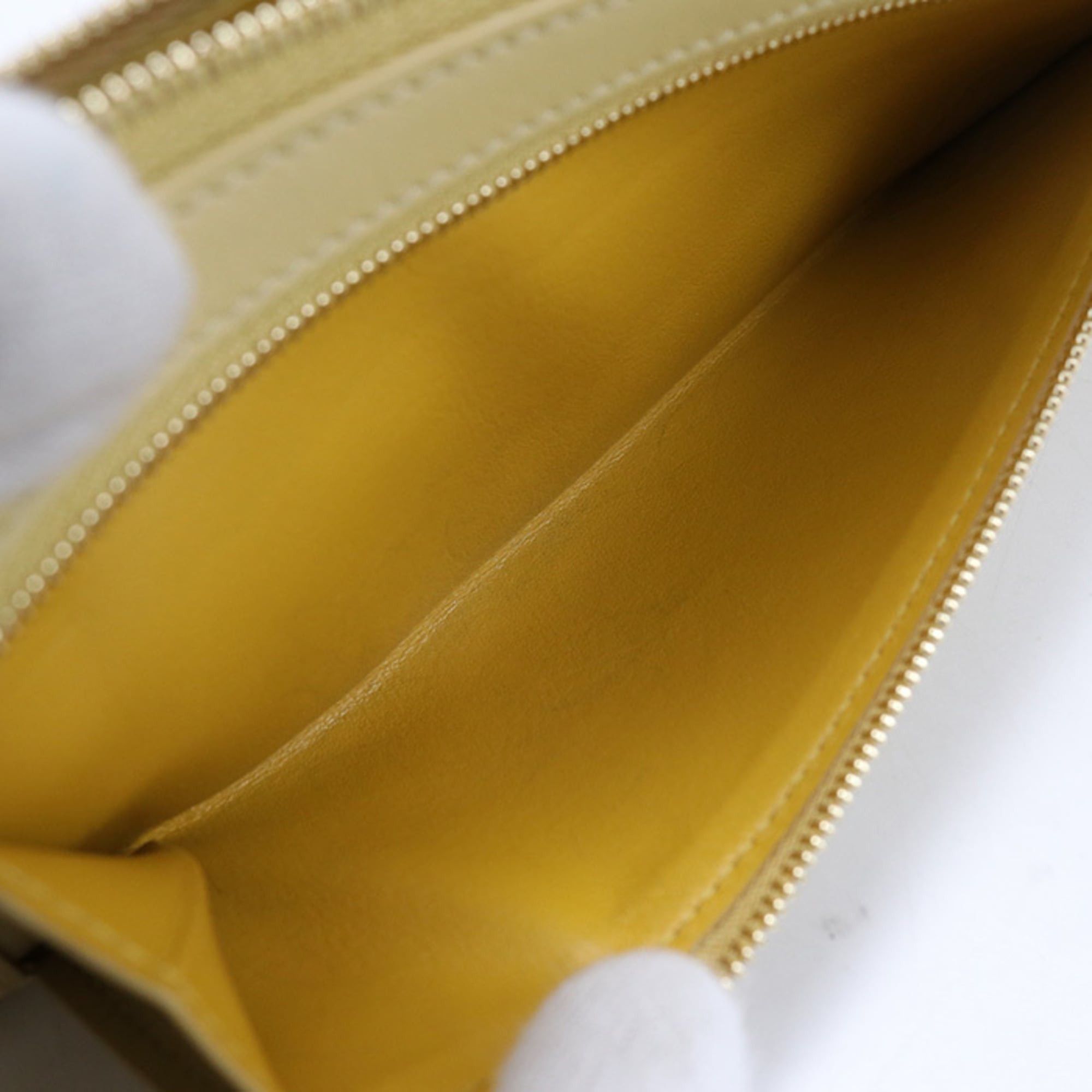 Loewe LOEWE women's zip-around long wallet with round zipper and knot design, yellow. Size ONE SIZE - 8 Thumbnail
