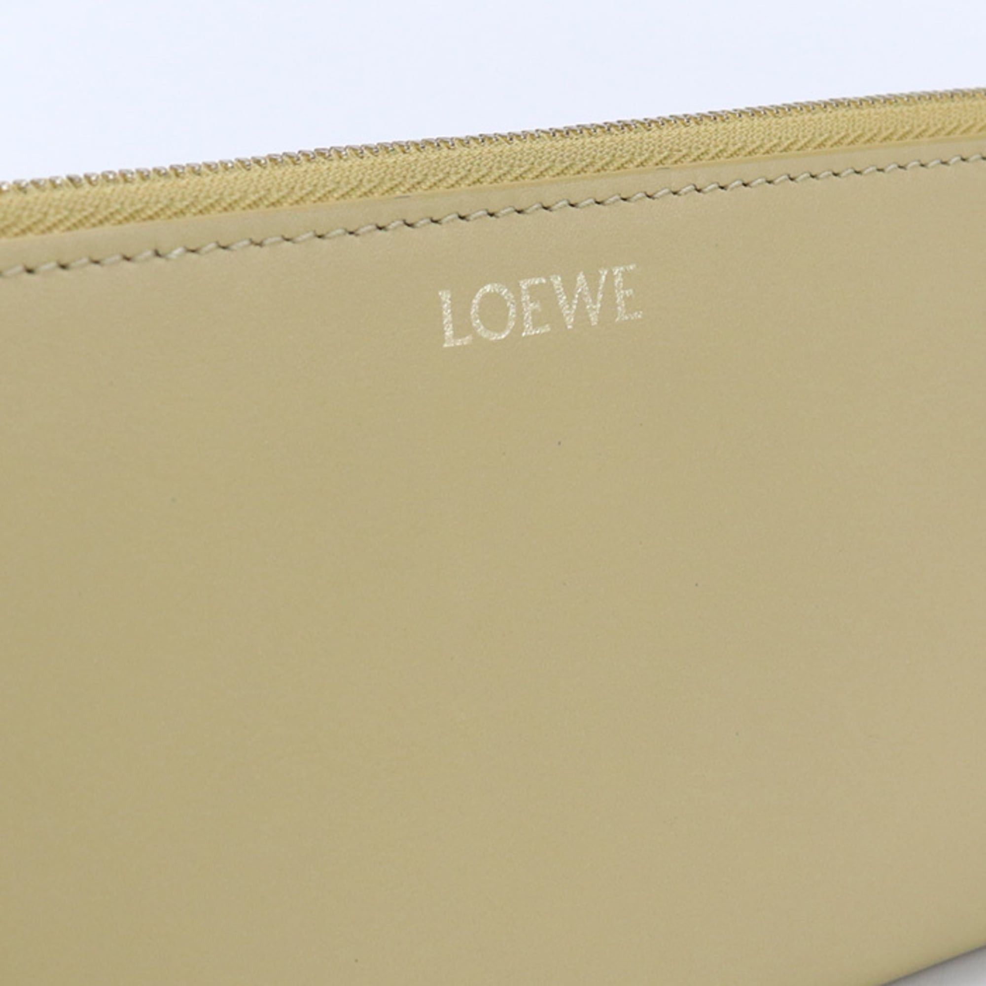 Loewe LOEWE women's zip-around long wallet with round zipper and knot design, yellow. Size ONE SIZE - 9 Thumbnail