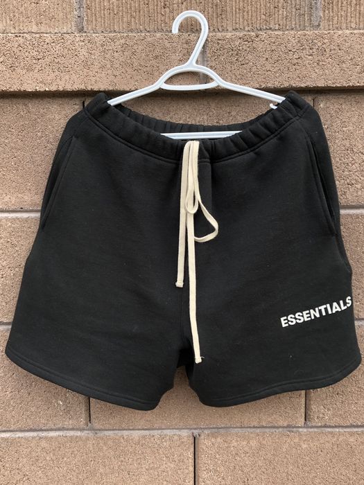 Fear of god essentials hot sale graphic sweat shorts black