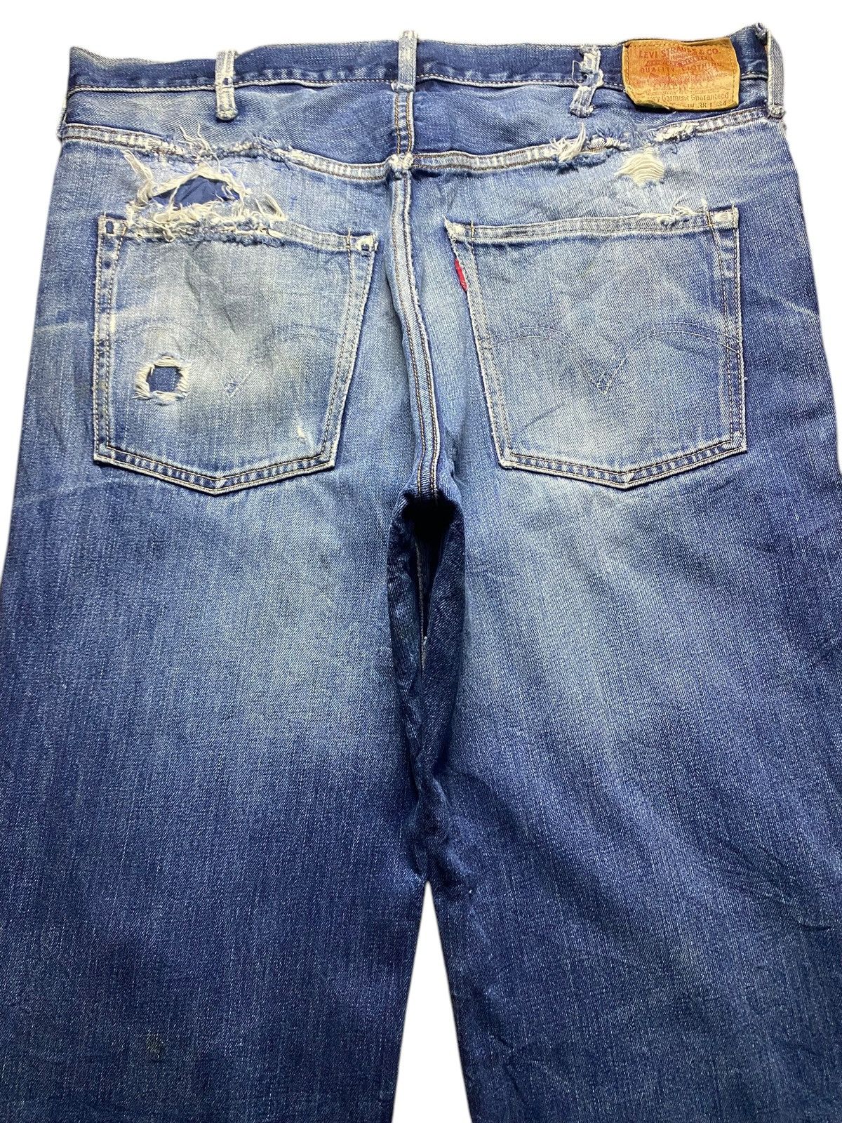 Vintage Levis 502 Blue Wash Ripped Straight Jeans