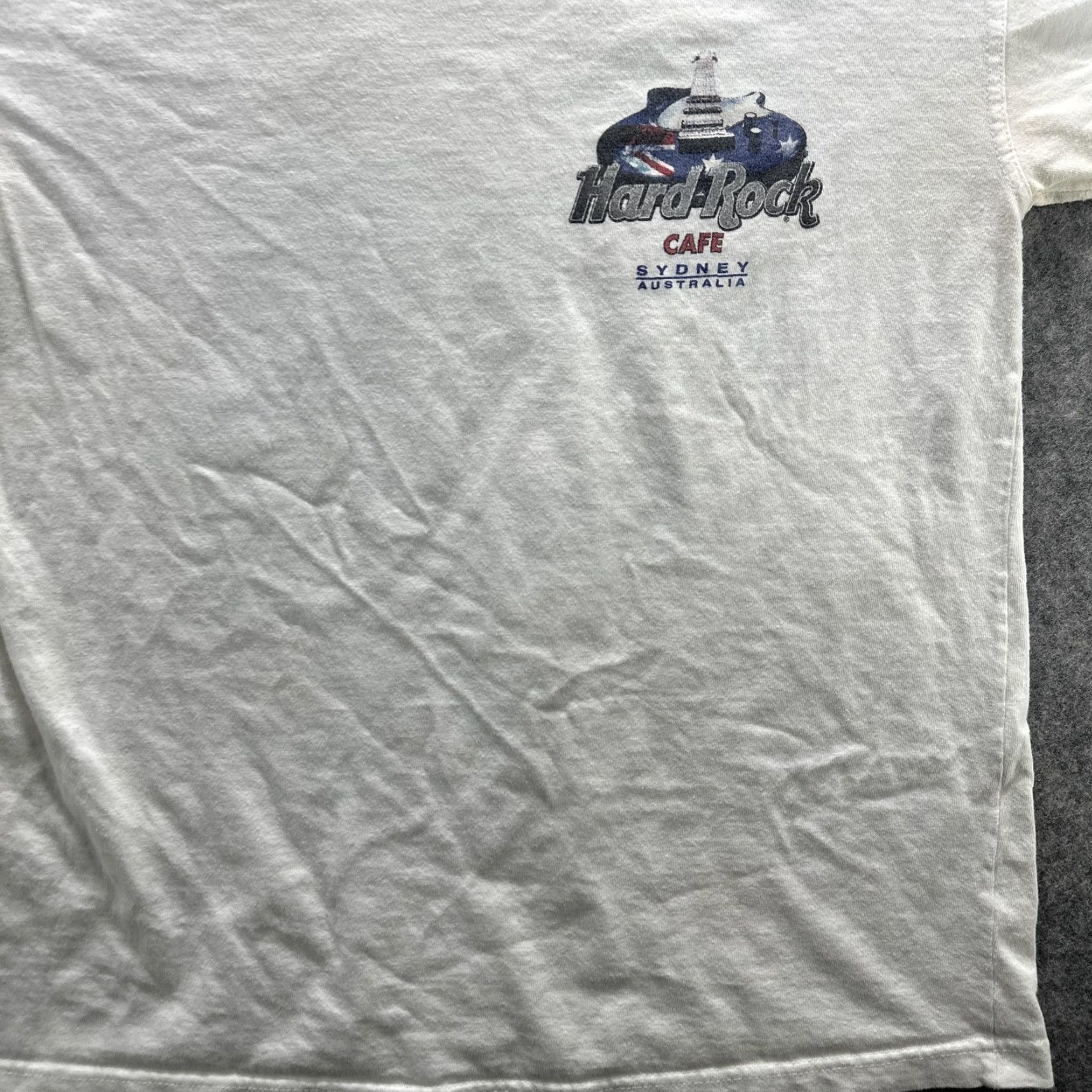 Hard Rock Cafe VINTAGE Hard Rock Cafe Shirt Mens Small White Sydney Australia 90s Guitar Rock Music Graphic Print Crew Neck Short Sleeve Cotton T-Shirt Size US S / EU 44-46 / 1 - 5 Thumbnail