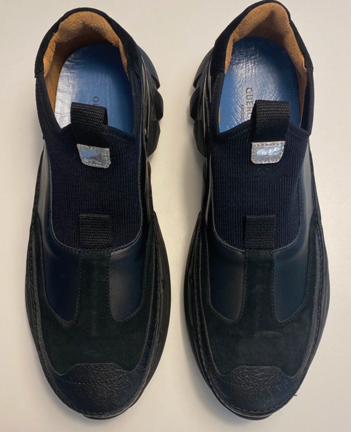 Black slip on sneakers