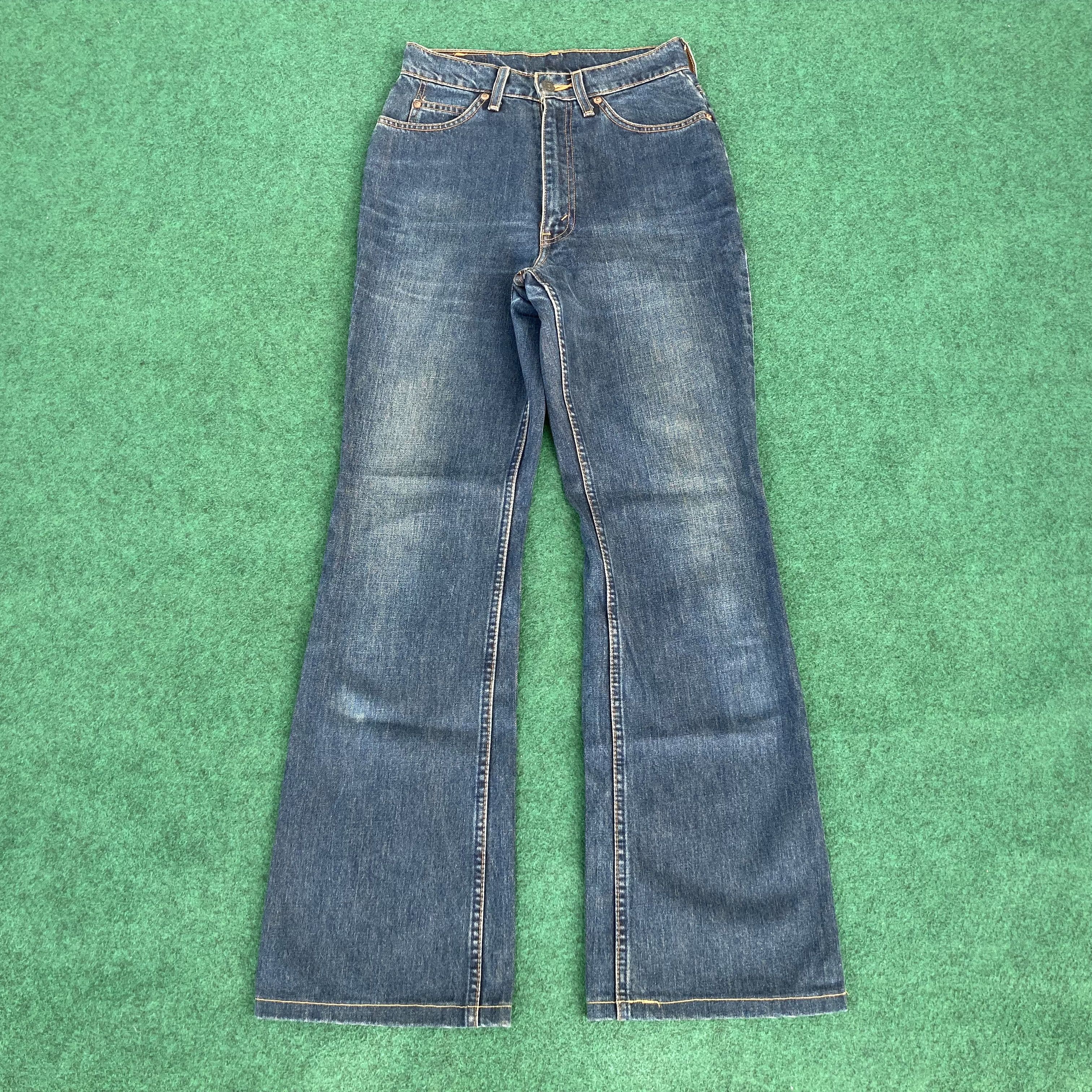 image of Distressed Denim x Levis Vintage Levis 857 Orange Tab Flared Denim Bootcut Jeans in Blue (Size 26)