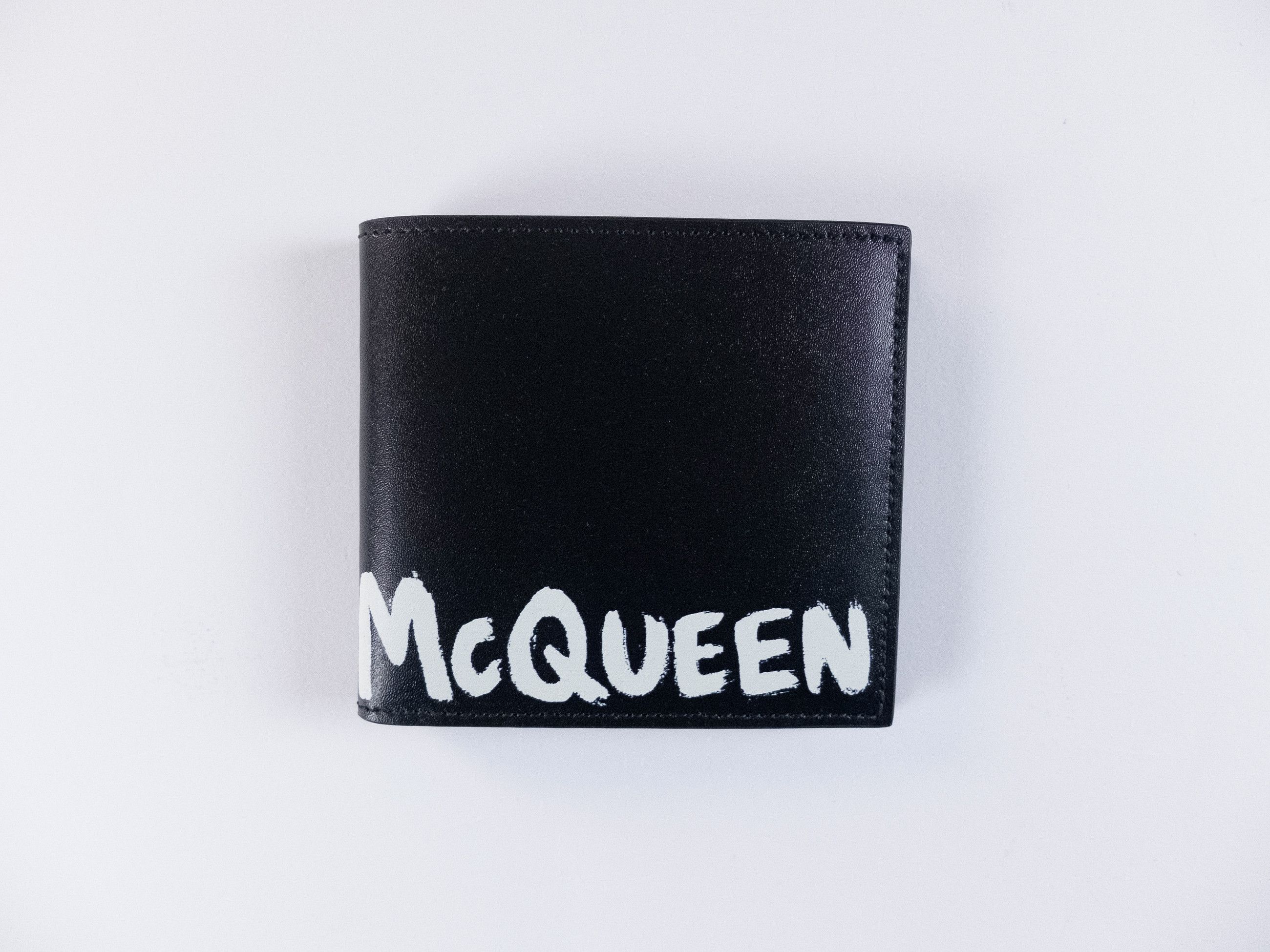 Alexander McQueen ALEXANDER MCQUEEN black graffiti logo leather bifold wallet Size ONE SIZE - 1 Thumbnail