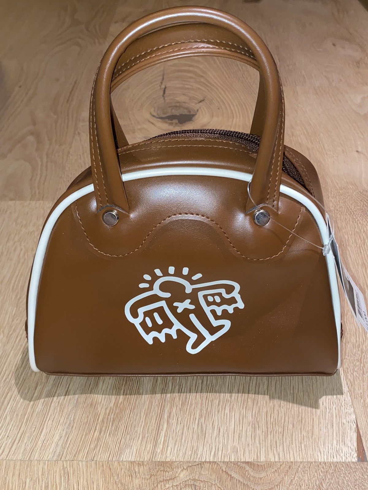 image of Keith Haring Flying Wings Leather Mini Handbag in Brown, Women's