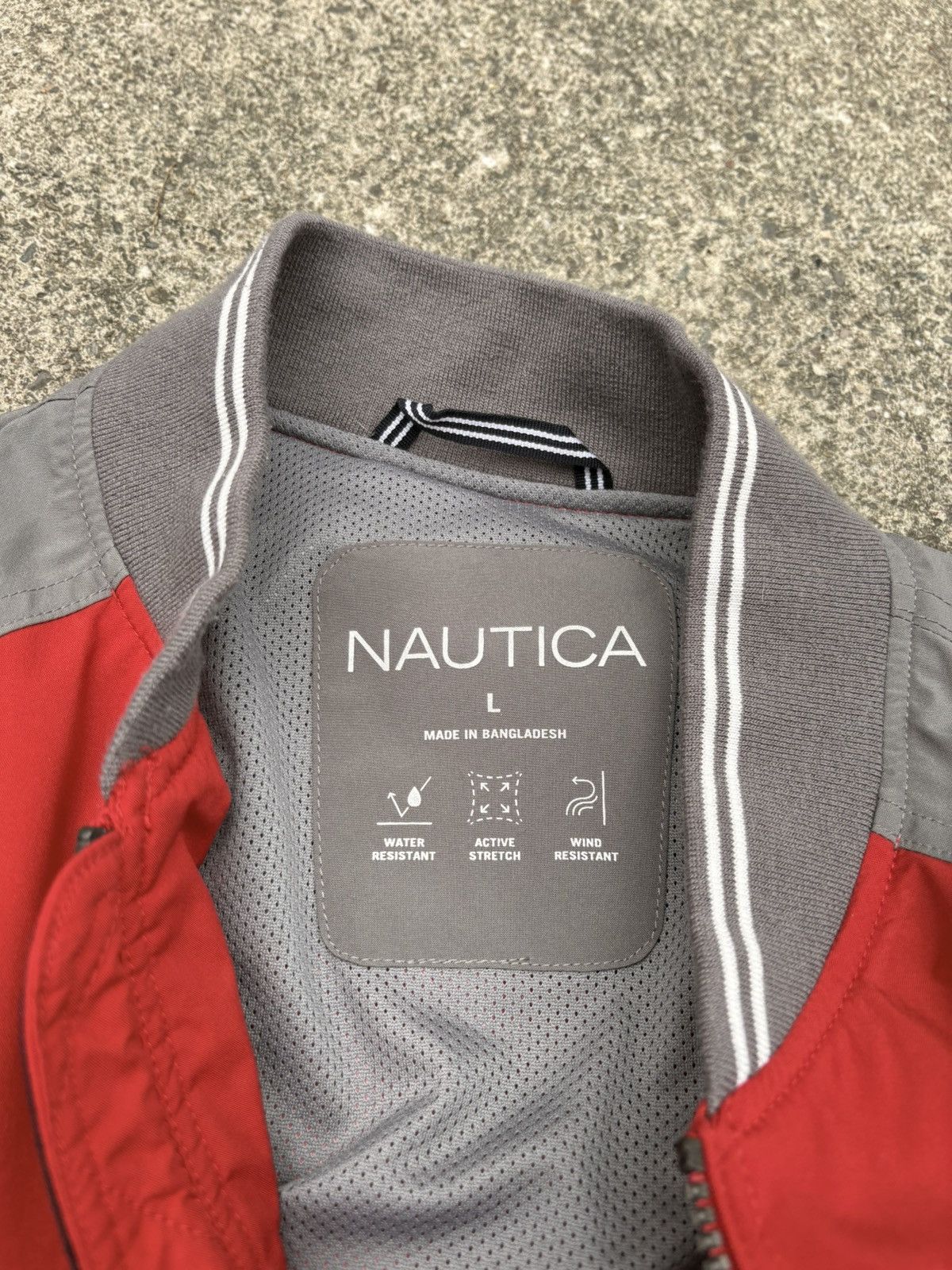 Nautica Nautica full-zip bomber in a red and grey colorblock build. Size US L / EU 52-54 / 3 - 4 Thumbnail